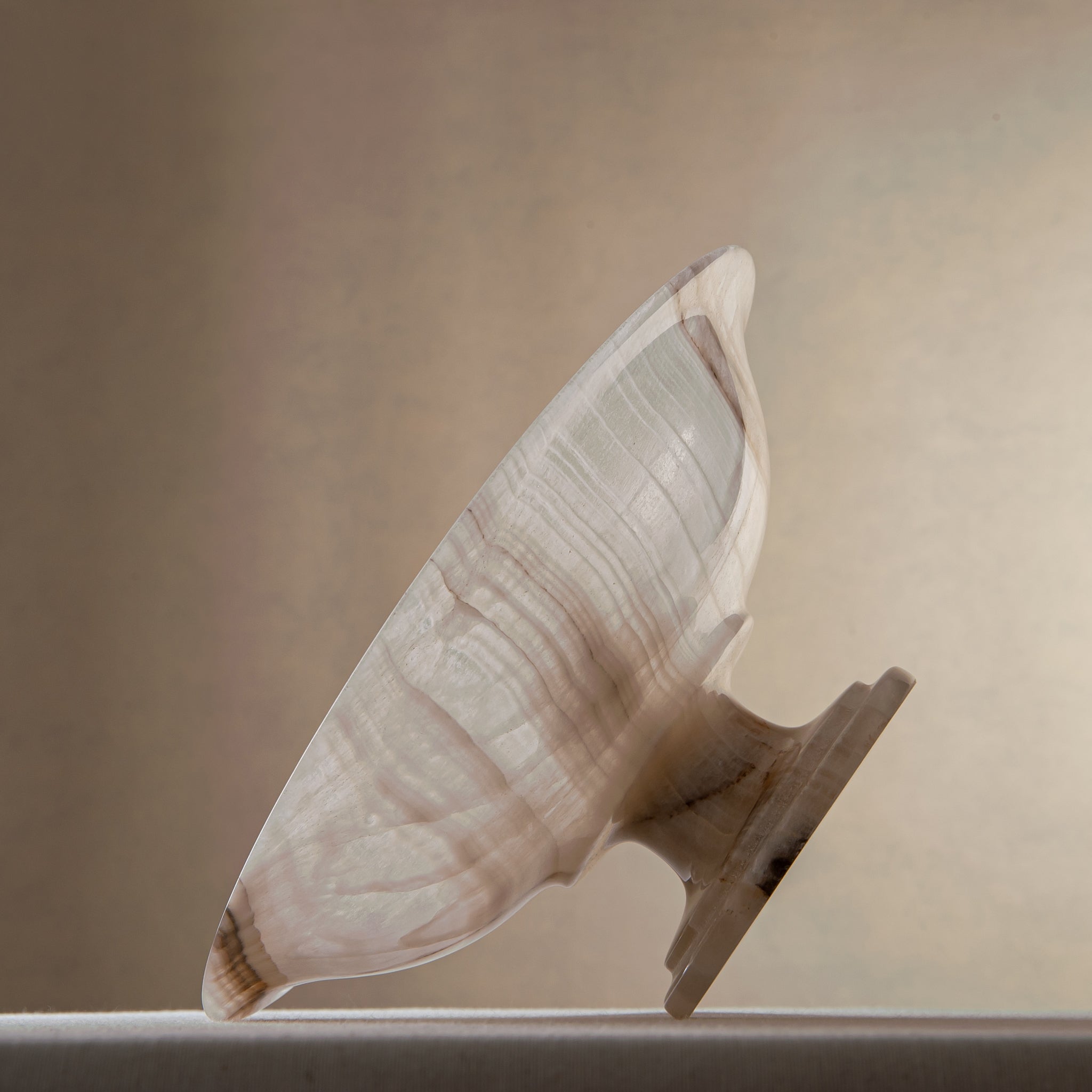 handcrafted onyx bowl with neutral translucency and beige grey veining for luxury decor
