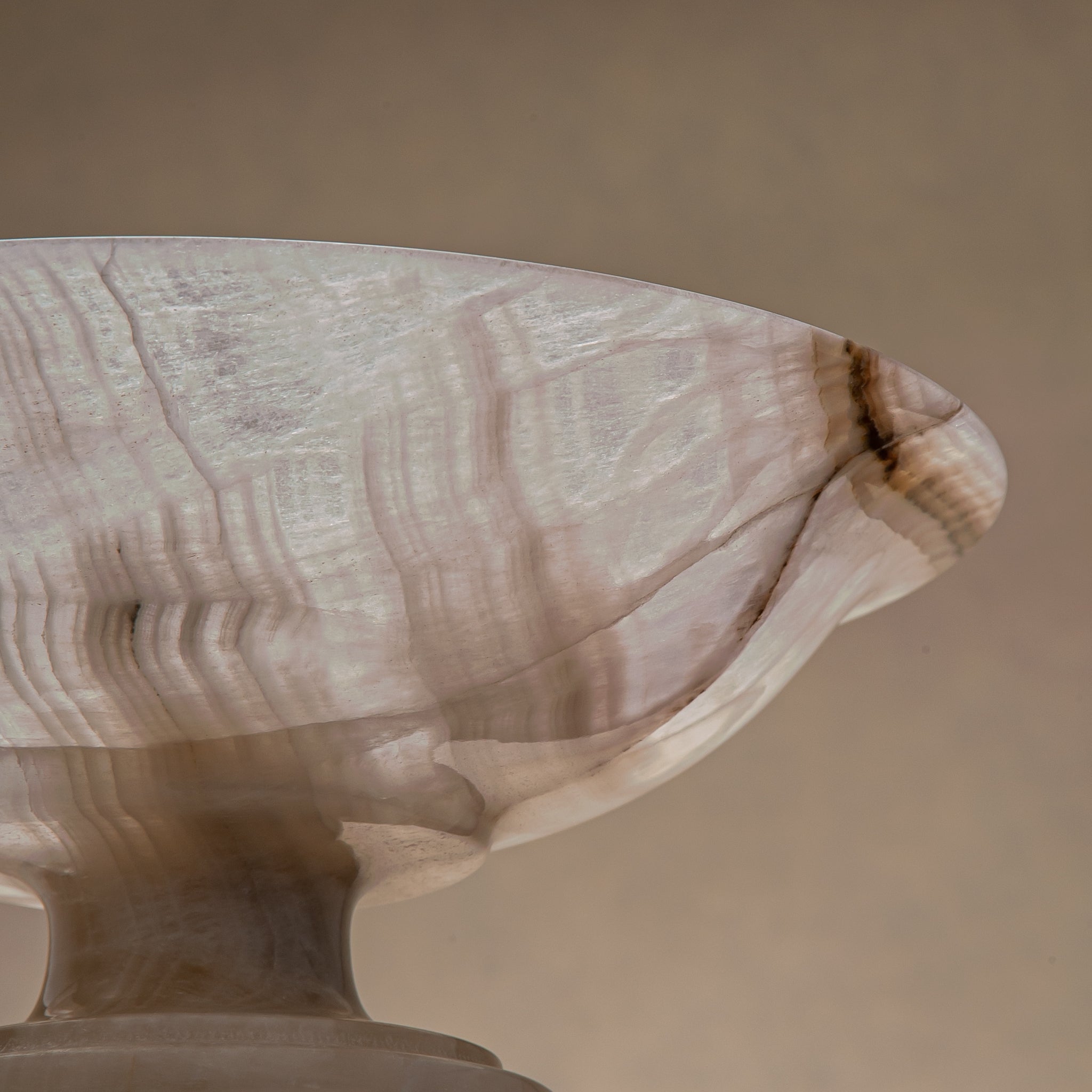 handcrafted onyx bowl with neutral translucency and beige grey veining for luxury decor
