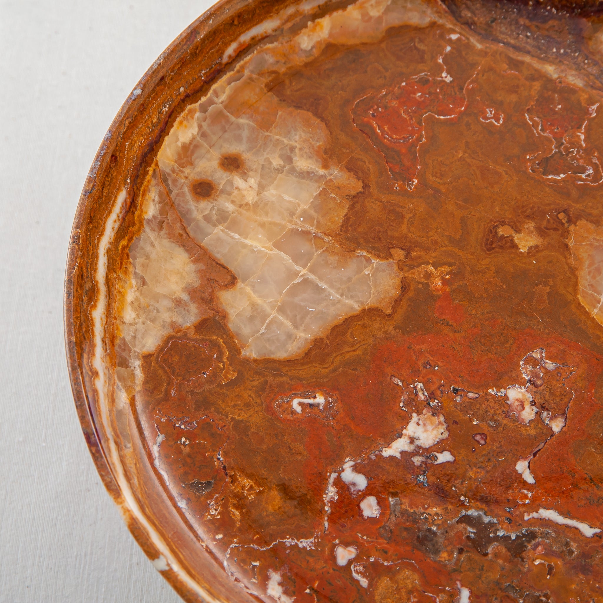 handcrafted onyx bowl with pedestal base and amber translucent veining for luxury centerpiece
