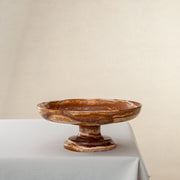 handcrafted onyx bowl with pedestal base and amber translucent veining for luxury centerpiece
