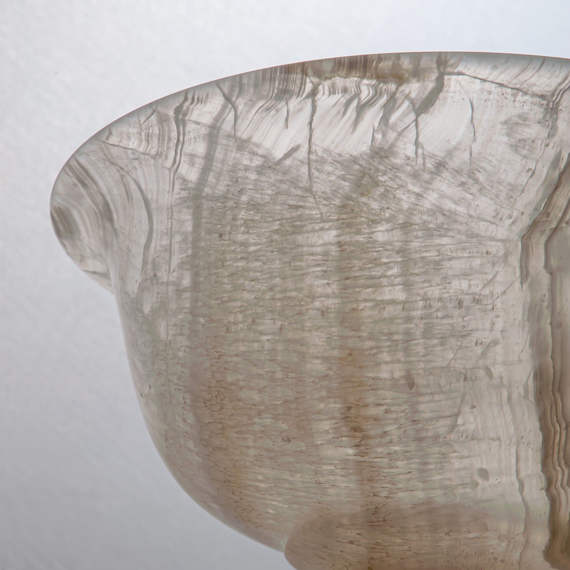 handcrafted onyx bowl with pedestal base and translucent ivory tones for luxury centerpiece decor
