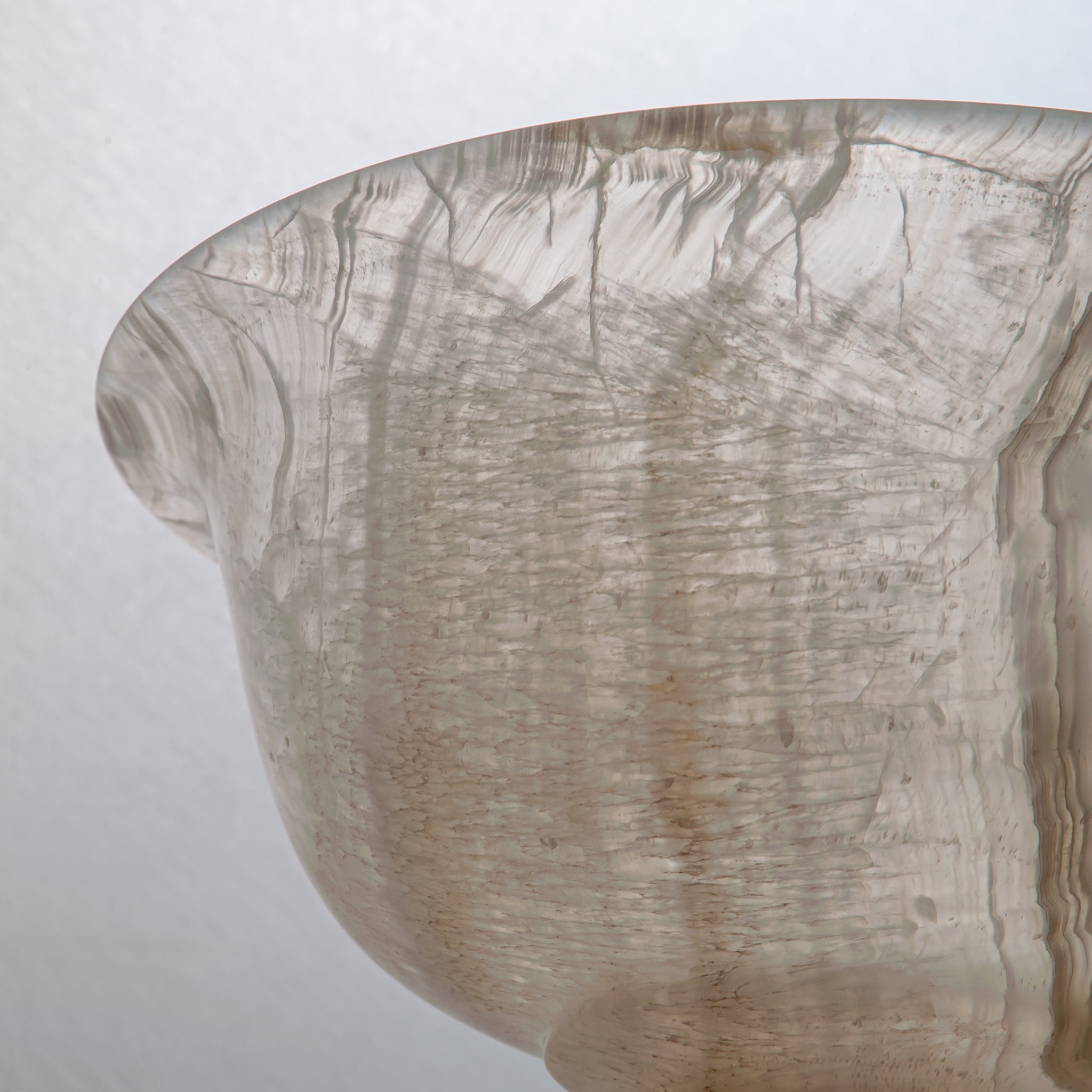 handcrafted onyx bowl with pedestal base and translucent ivory tones for luxury centerpiece decor
