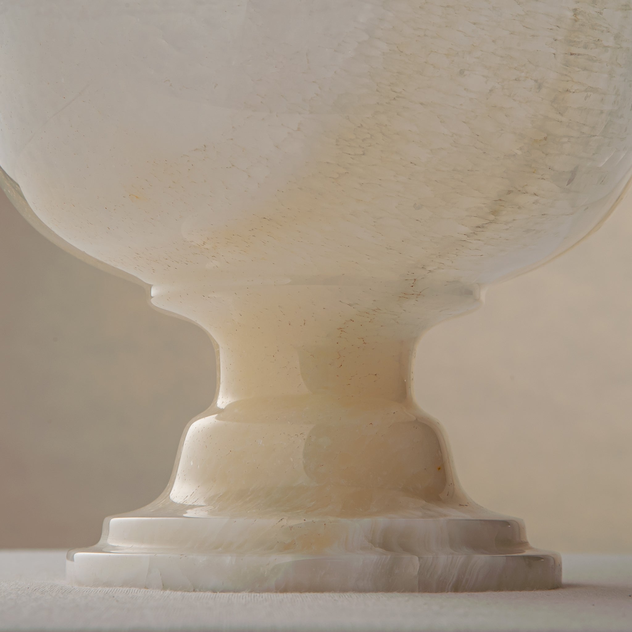 handcrafted onyx bowl with pedestal base and translucent ivory tones for luxury centerpiece decor
