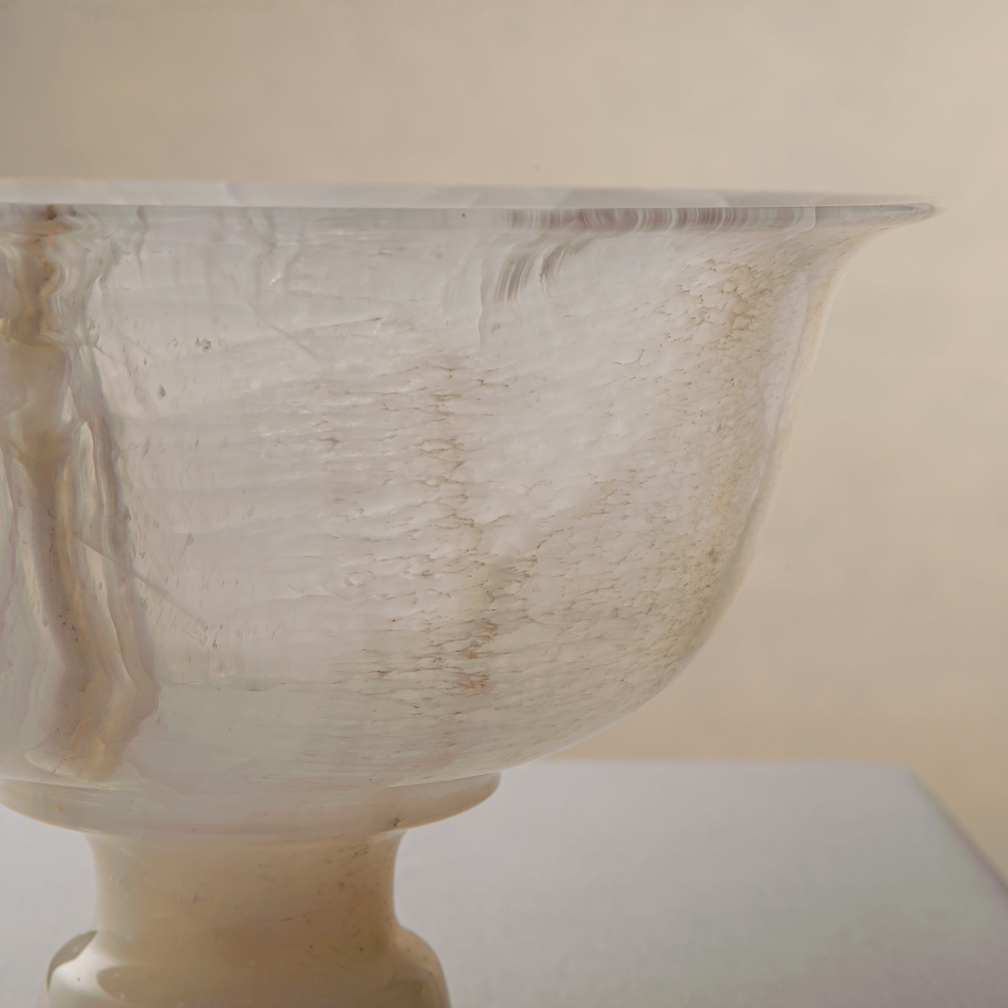 handcrafted onyx bowl with pedestal base and translucent ivory tones for luxury centerpiece decor
