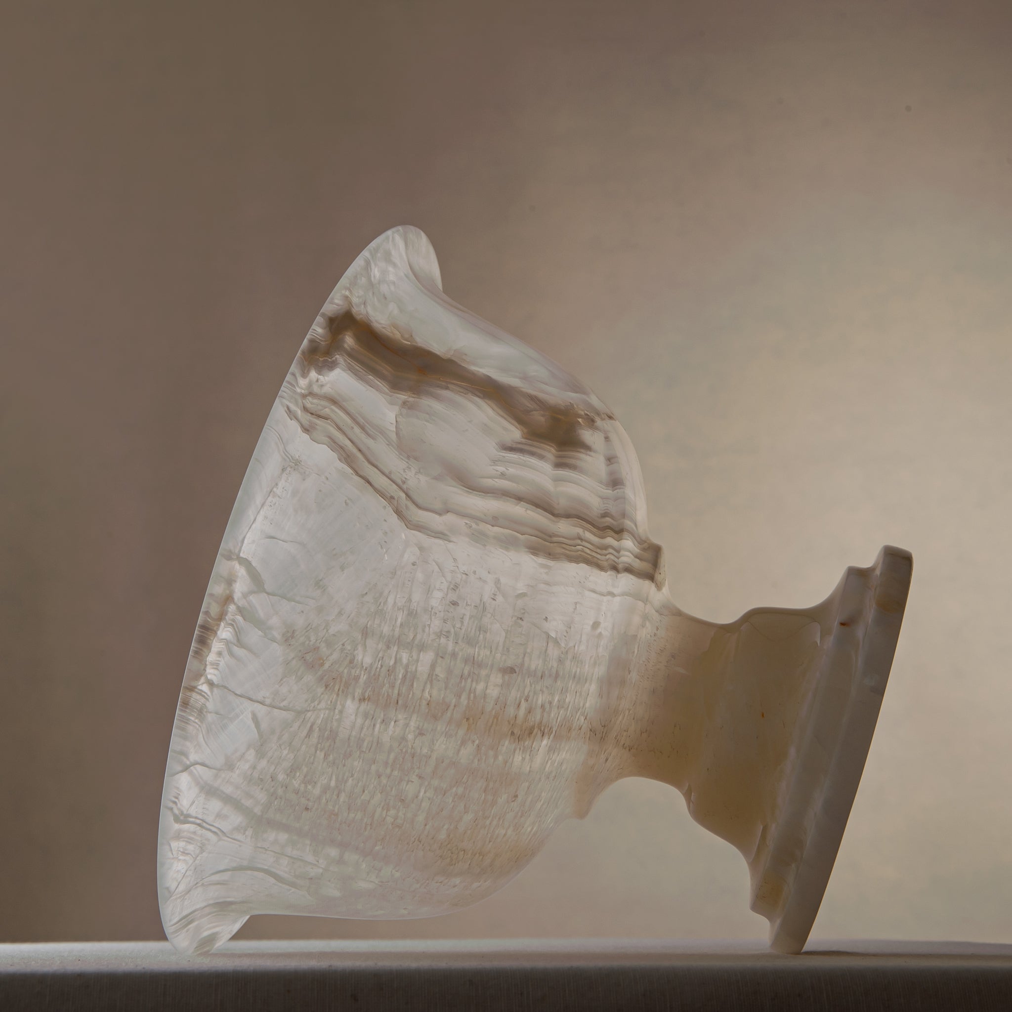 handcrafted onyx bowl with pedestal base and translucent ivory tones for luxury centerpiece decor
