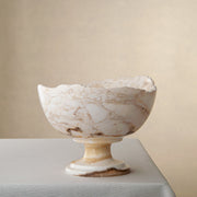 handcrafted onyx bowl with pedestal base in ivory tones and natural veining for luxury decor
