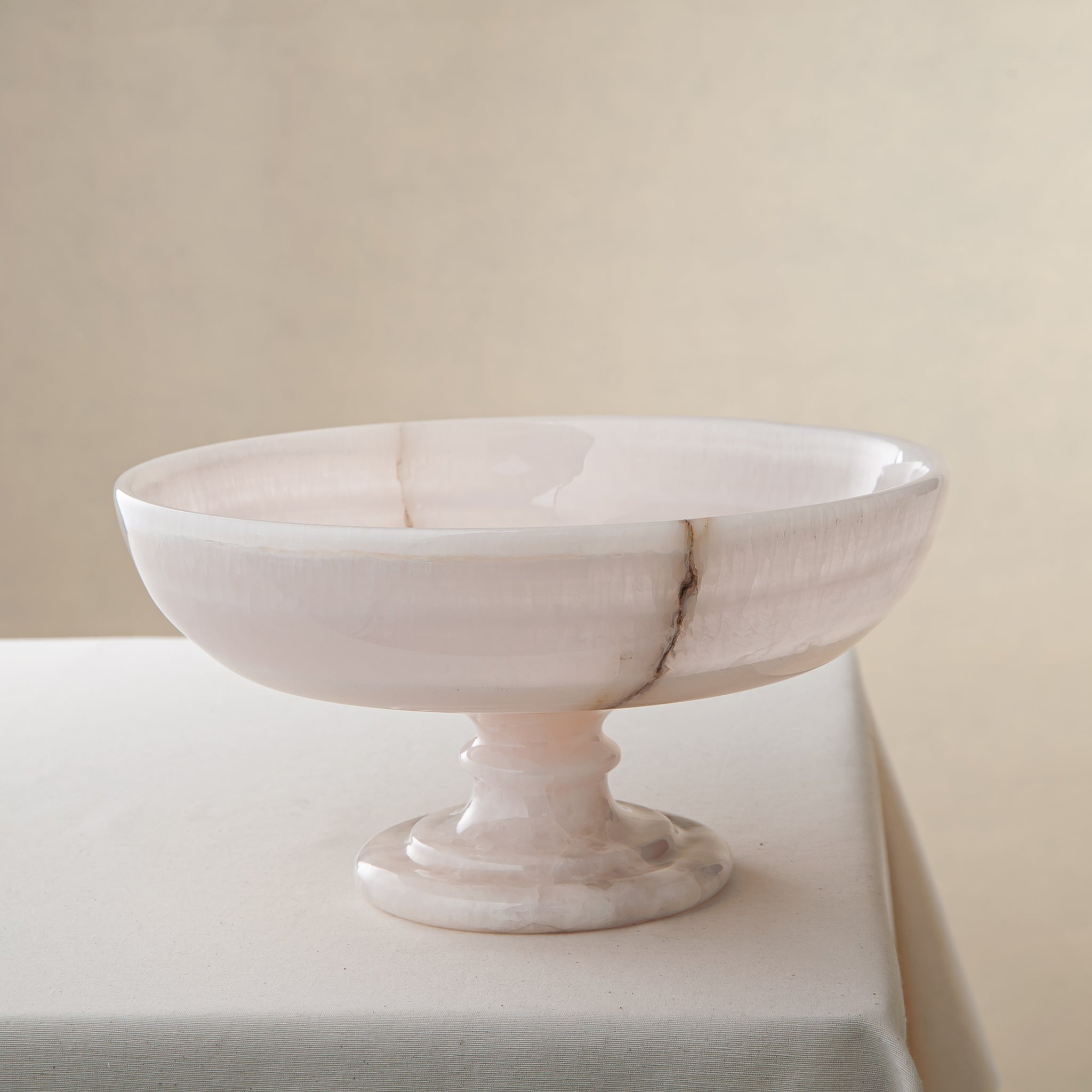 handcrafted onyx bowl with pedestal base milky white translucent stone and natural veining for centerpiece

