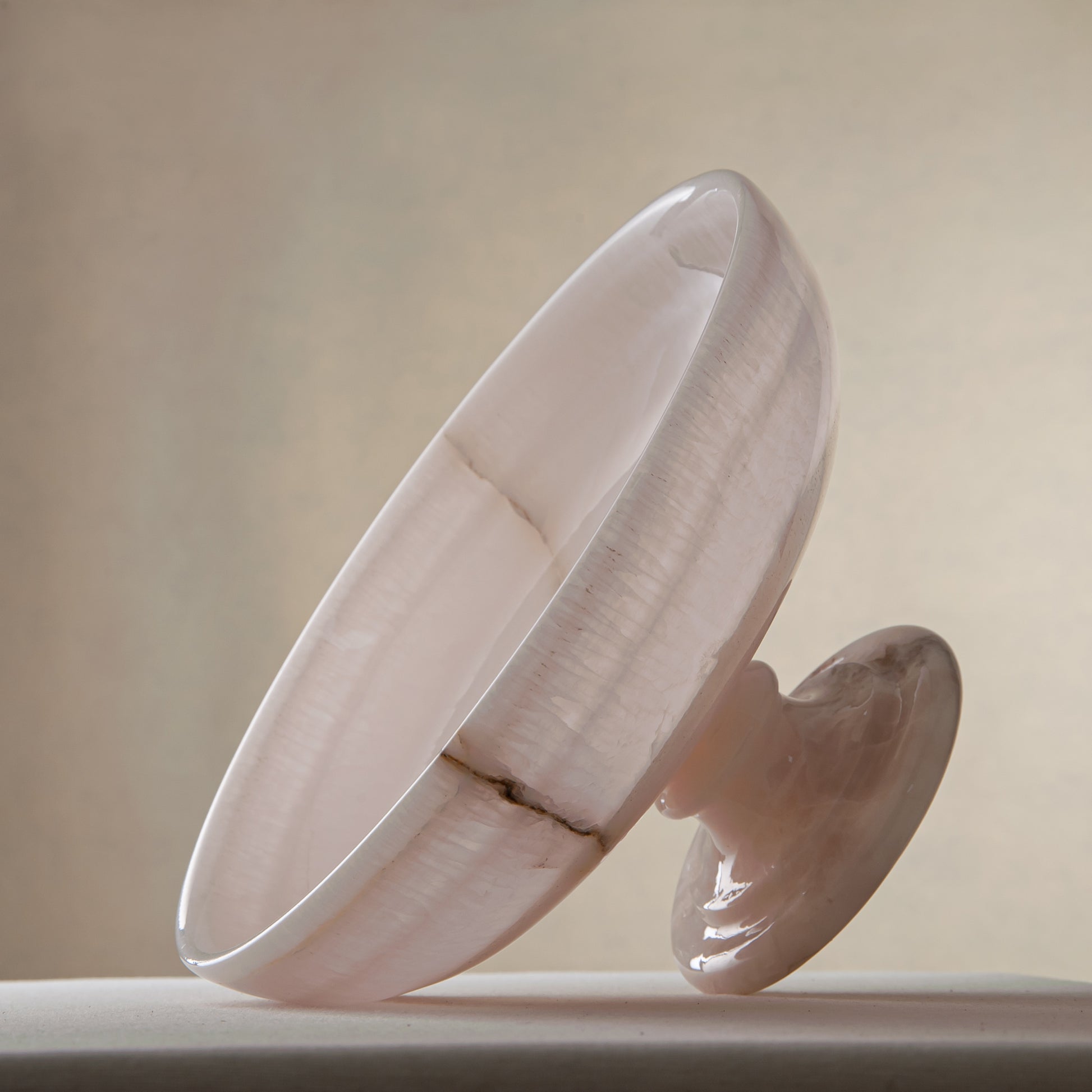 handcrafted onyx bowl with pedestal base milky white translucent stone and natural veining for centerpiece
