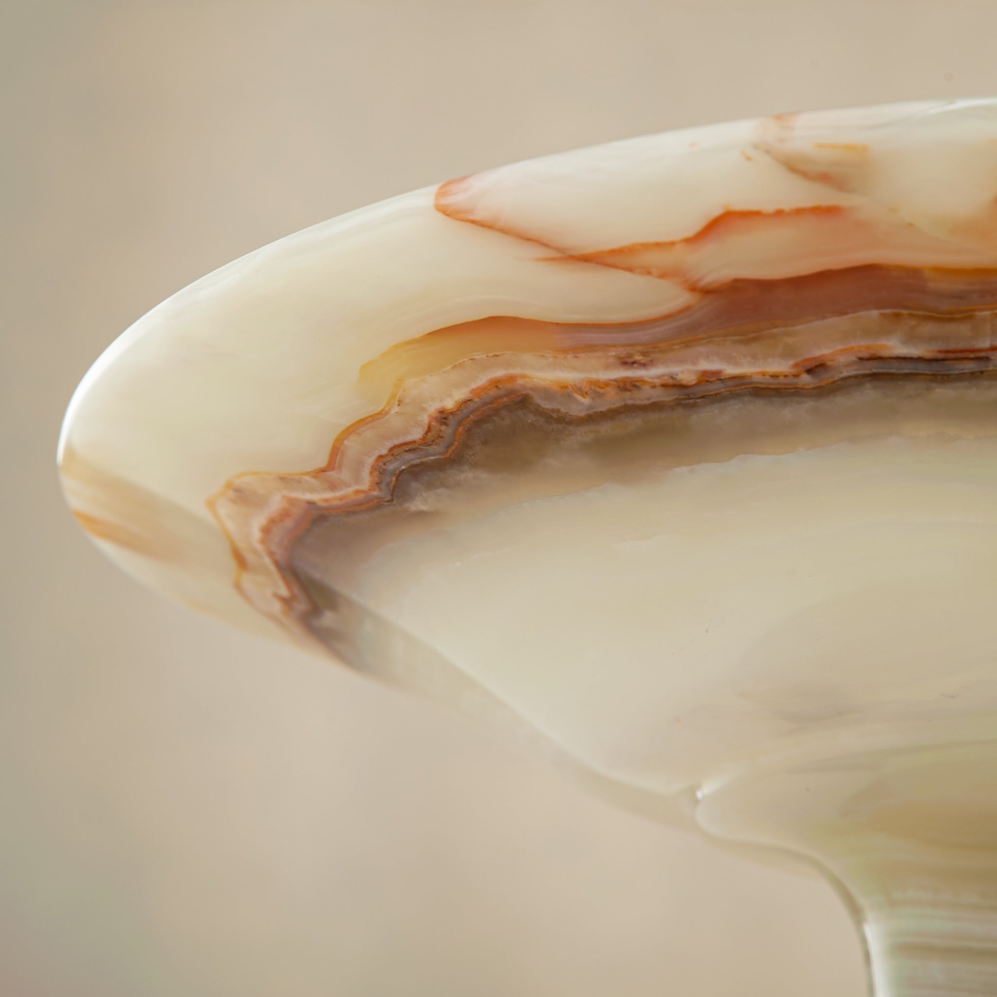 handcrafted onyx bowl with pedestal base and translucent layered amber veining for luxury decor
