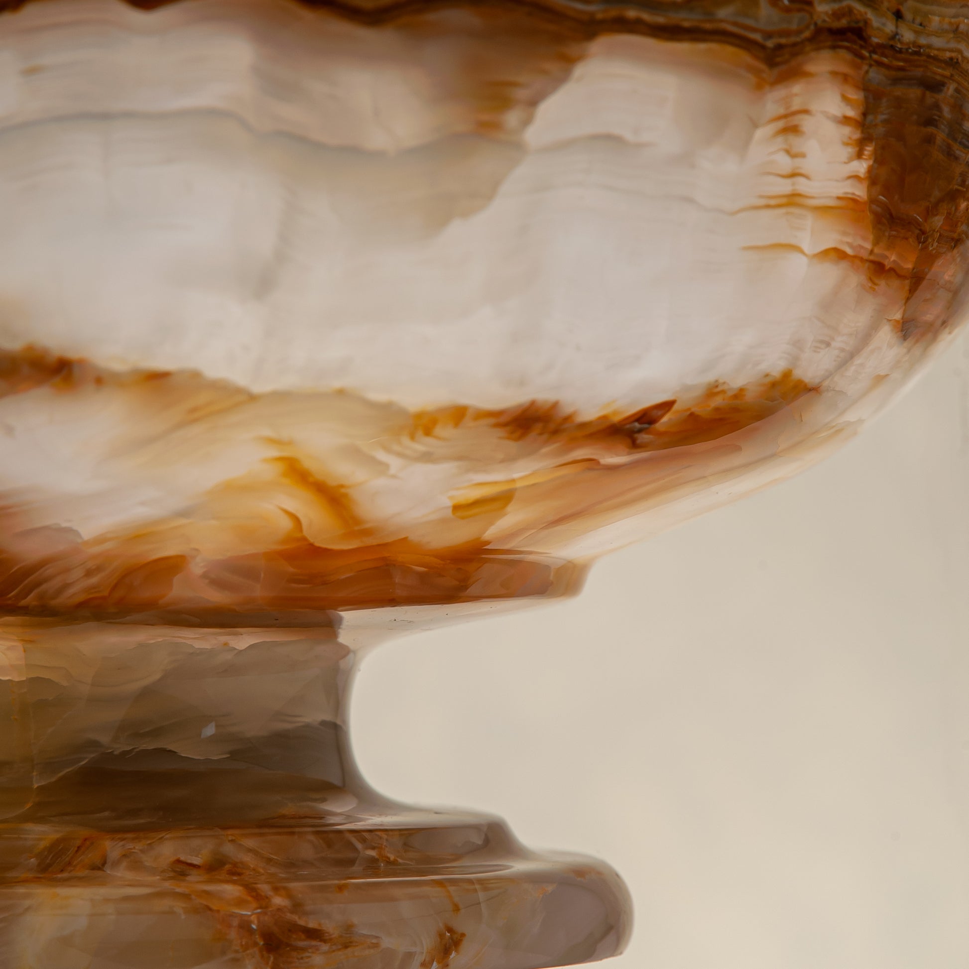 unique natural onyx bowl with irregular rim and warm honey tones as elegant centerpiece
