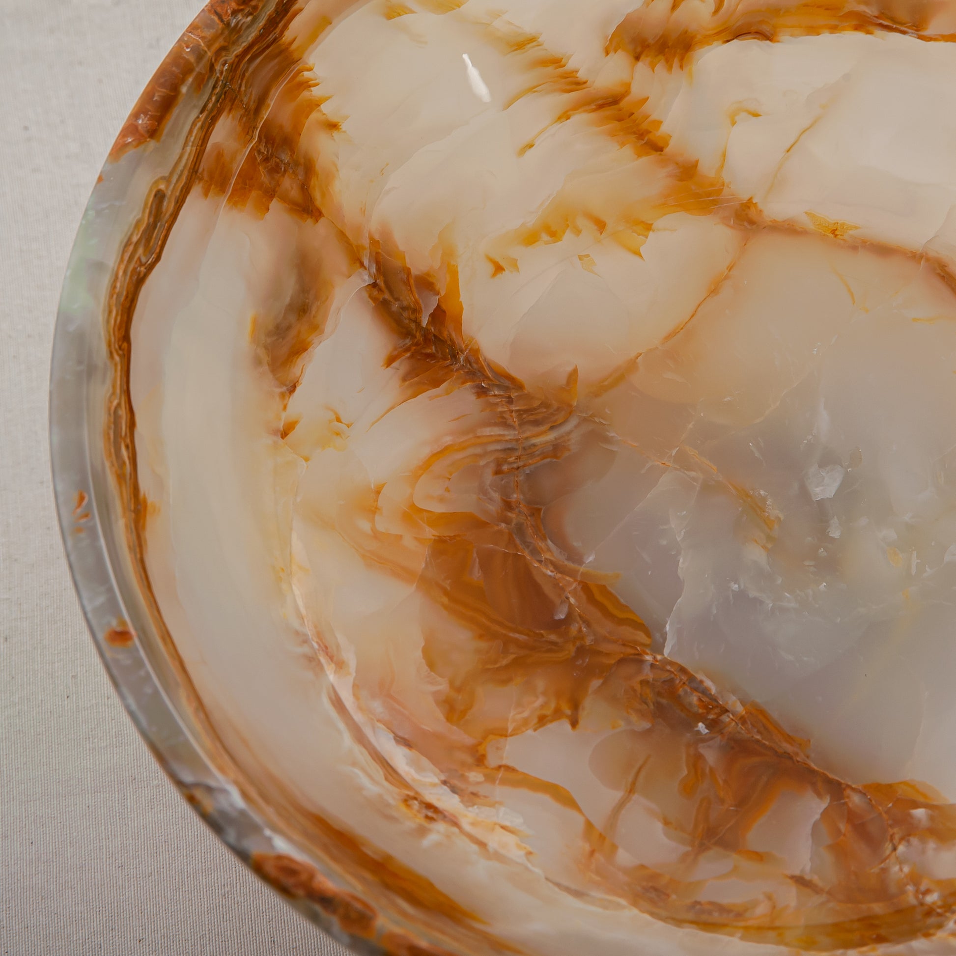 unique natural onyx bowl with irregular rim and warm honey tones as elegant centerpiece
