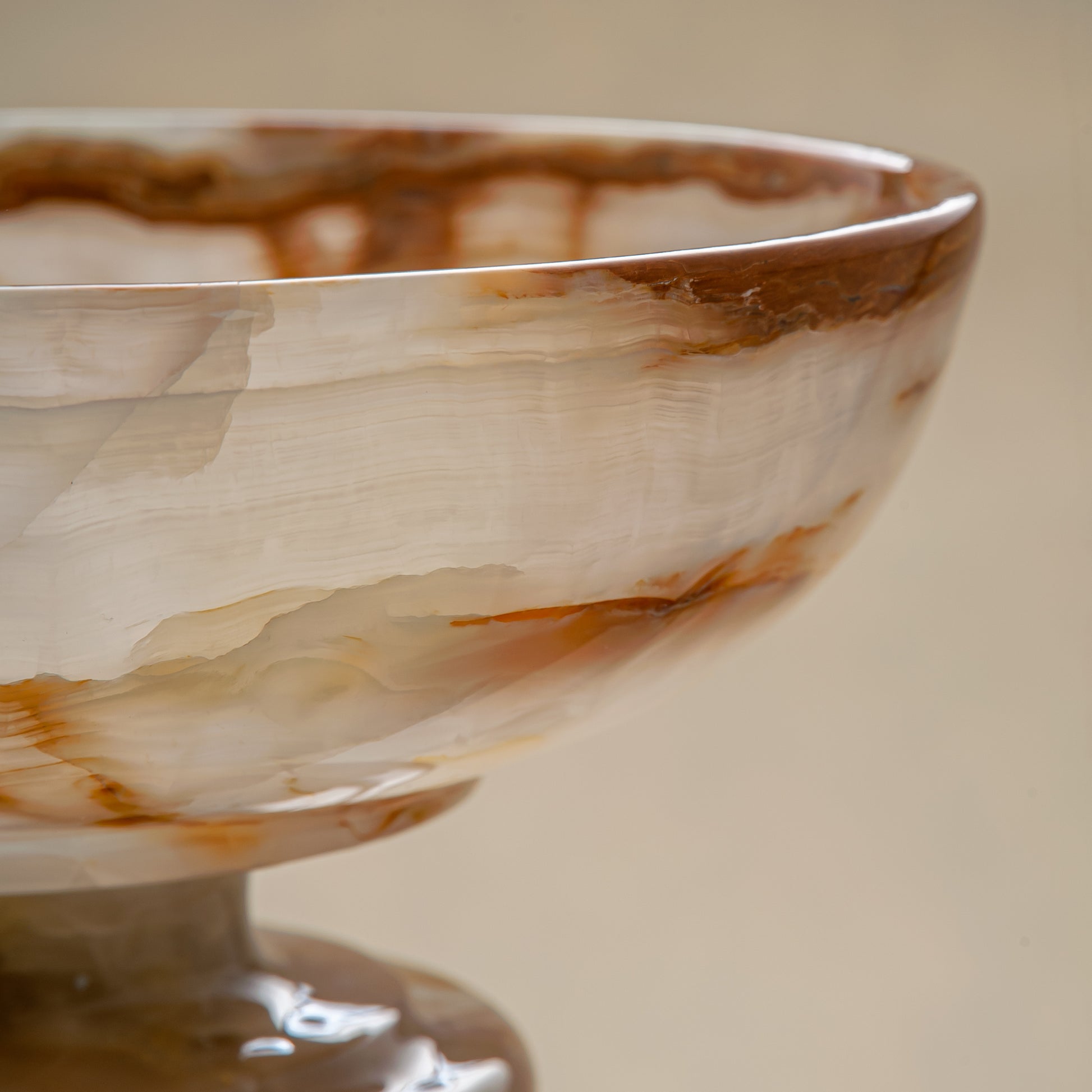 unique natural onyx bowl with irregular rim and warm honey tones as elegant centerpiece
