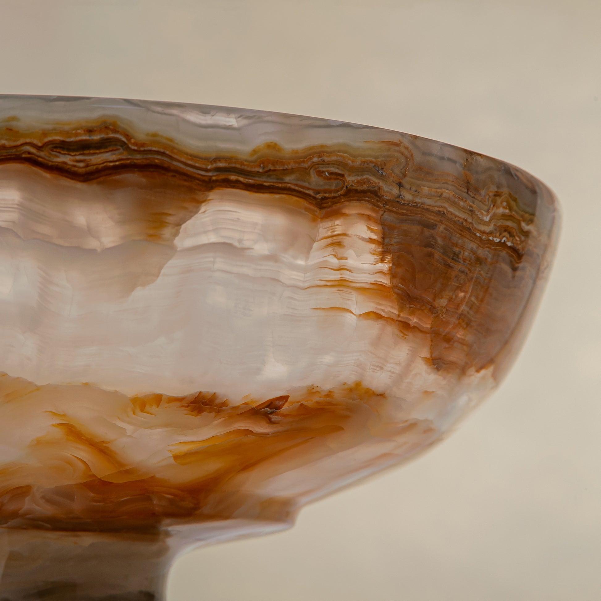unique natural onyx bowl with irregular rim and warm honey tones as elegant centerpiece
