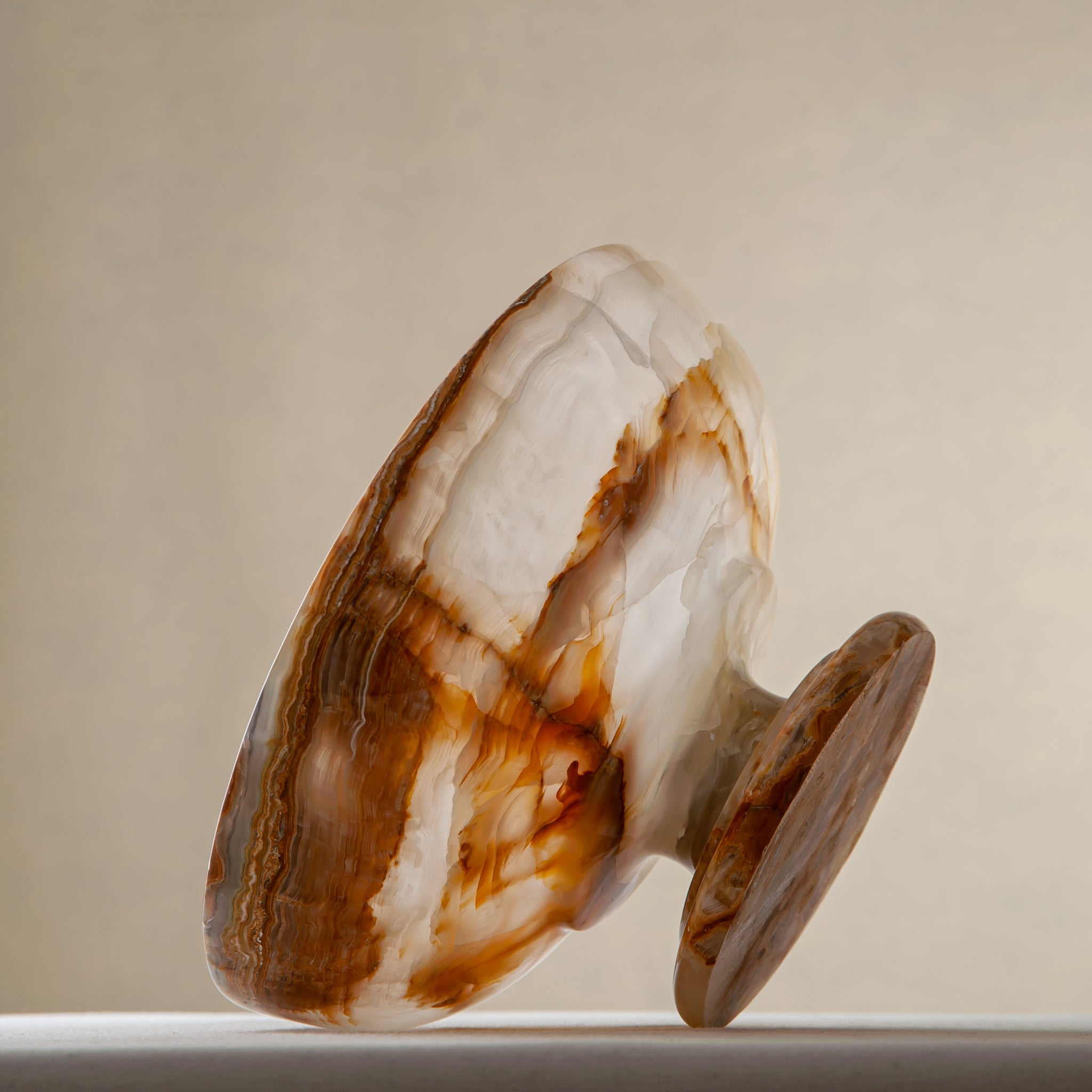 unique natural onyx bowl with irregular rim and warm honey tones as elegant centerpiece
