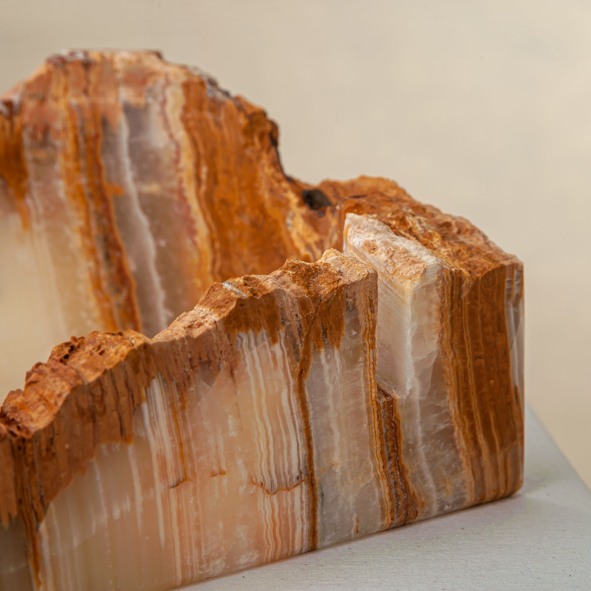 handcrafted rough onyx bowl with raw edges in white and amber tones for statement decor
