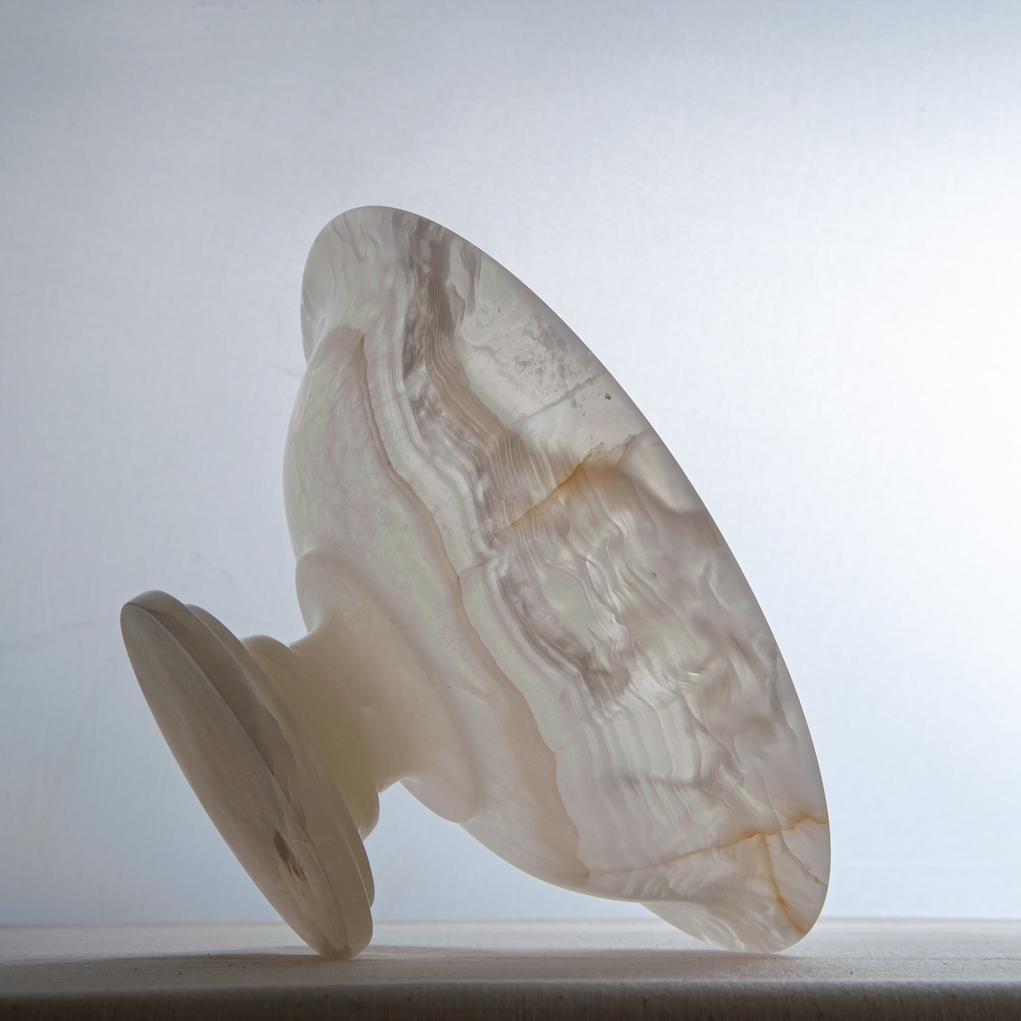 handcrafted onyx bowl with translucent ivory tones and natural veining for luxury table decor
