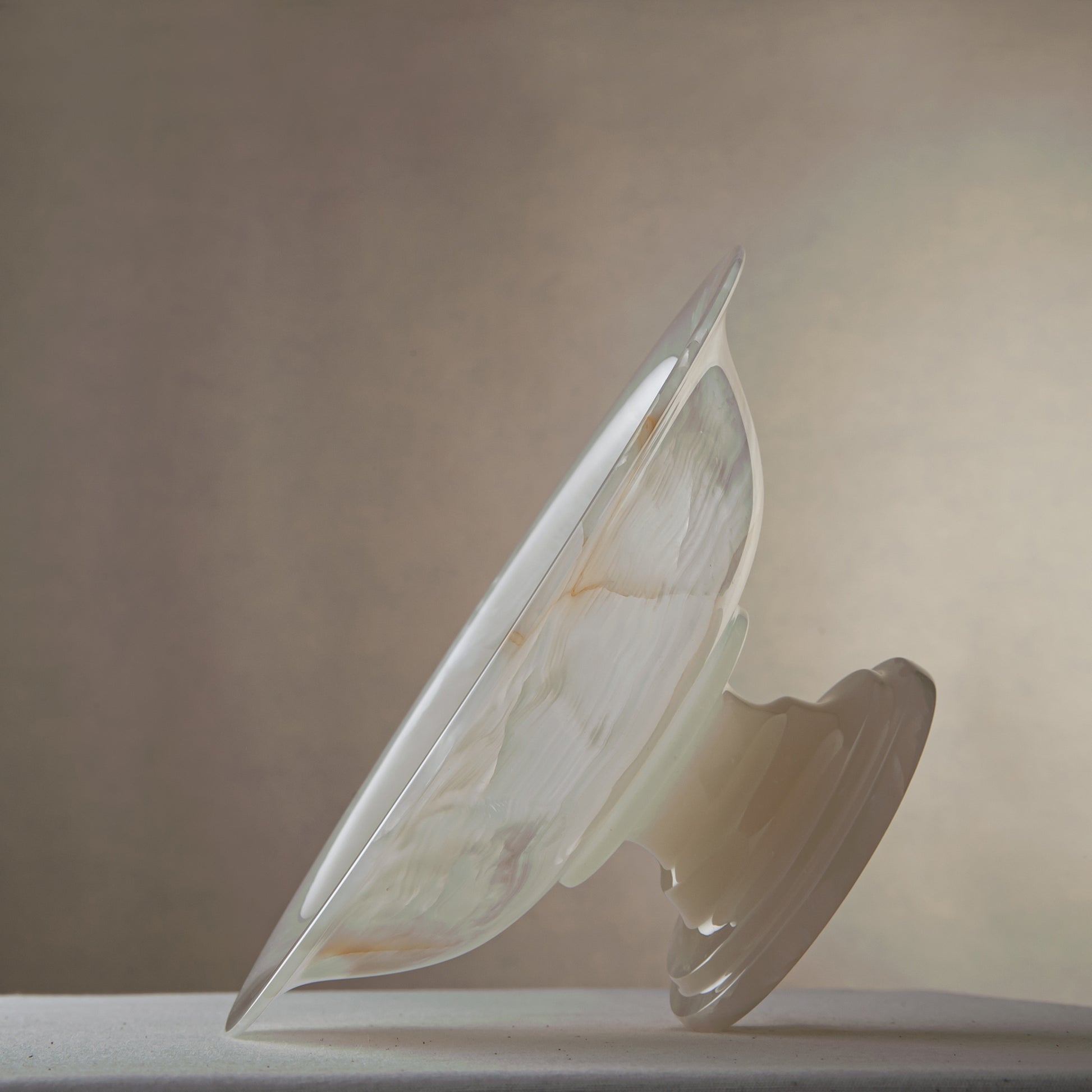handcrafted onyx bowl with translucent ivory tones and natural veining for luxury table decor
