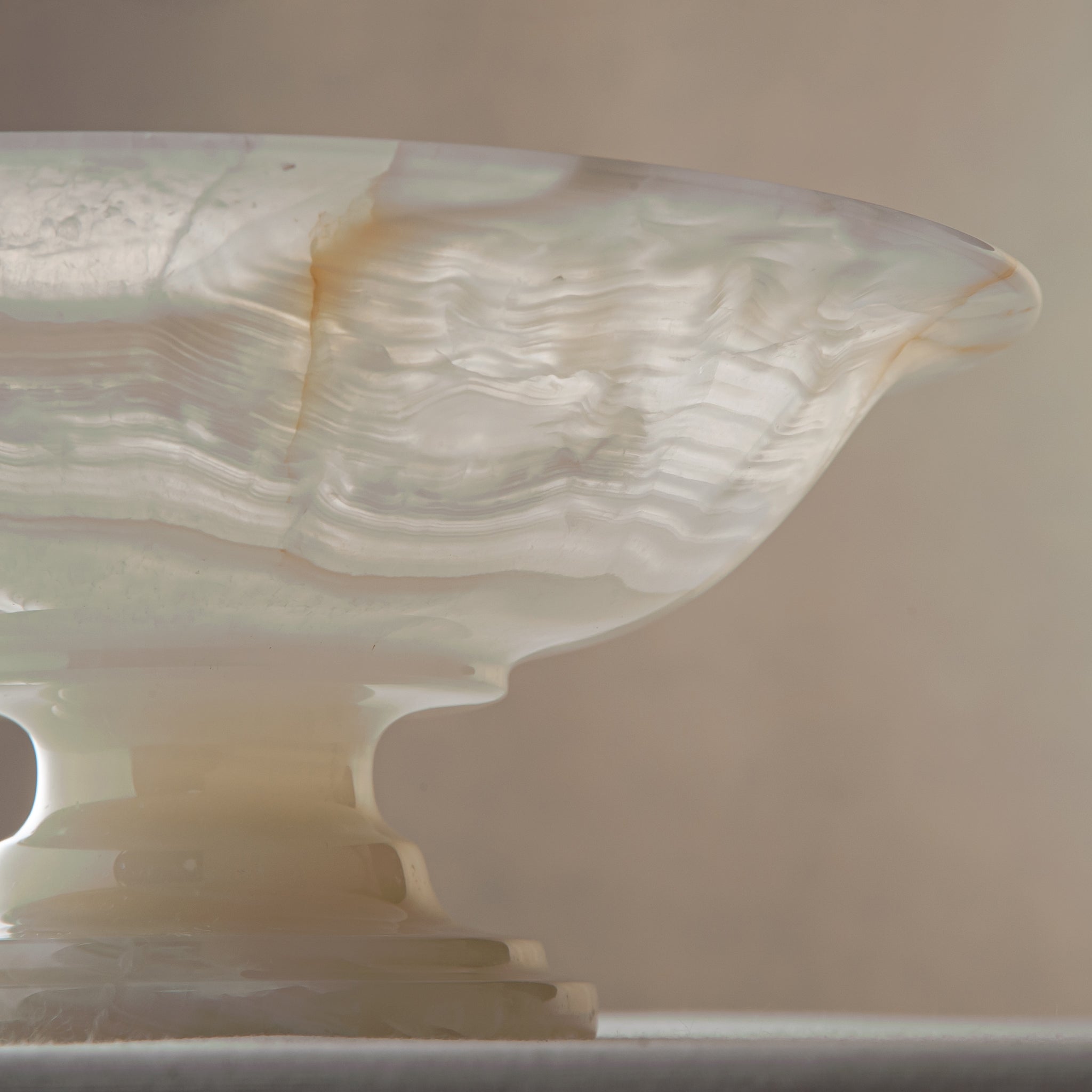 handcrafted onyx bowl with translucent ivory tones and natural veining for luxury table decor
