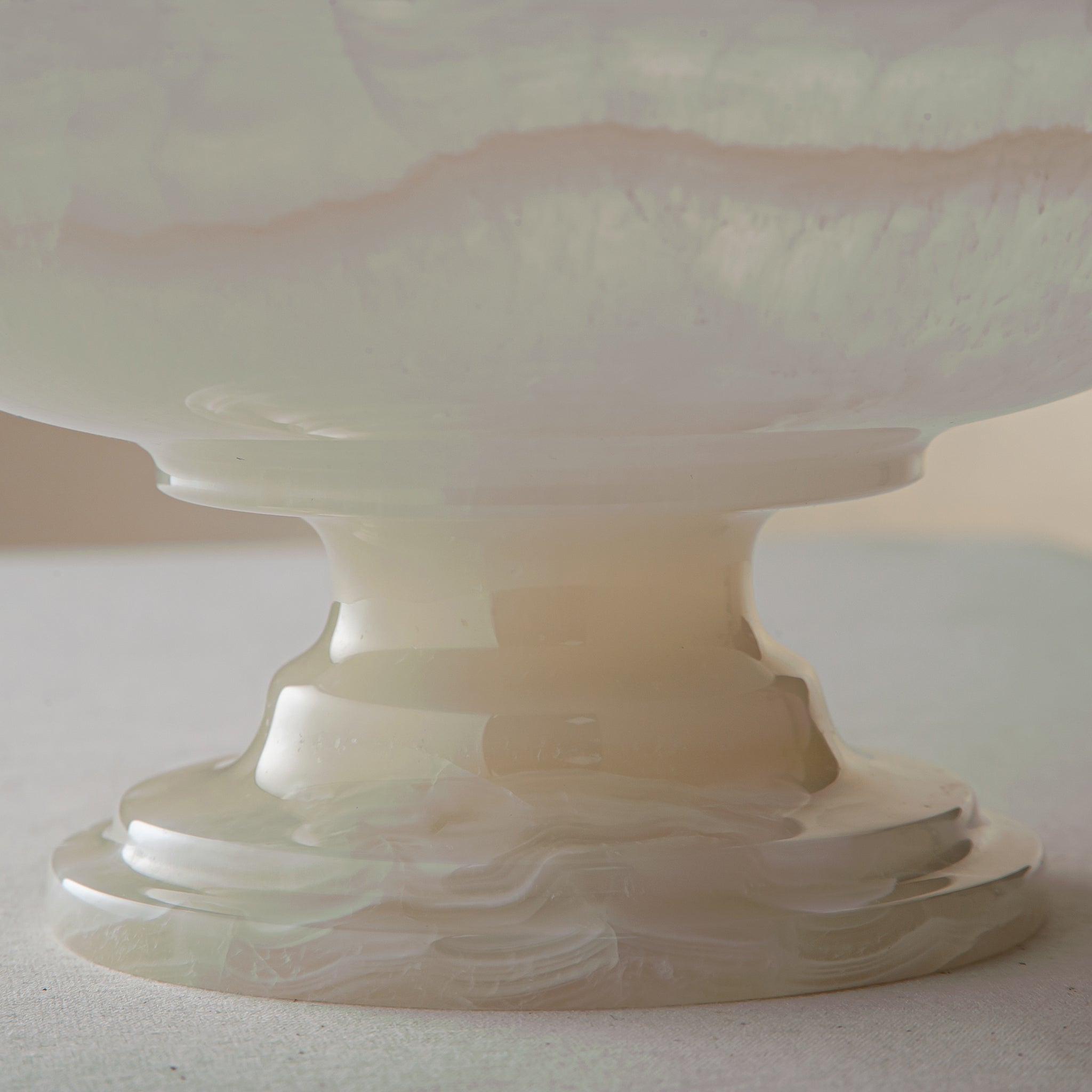 handcrafted onyx bowl with translucent ivory tones and natural veining for luxury table decor
