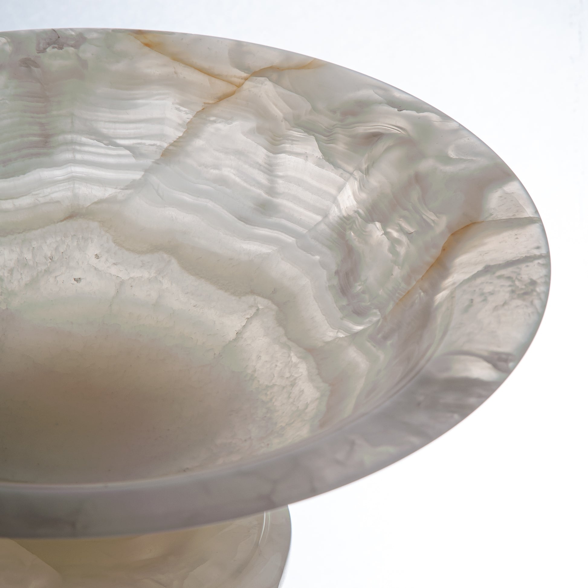 handcrafted onyx bowl with translucent ivory tones and natural veining for luxury table decor
