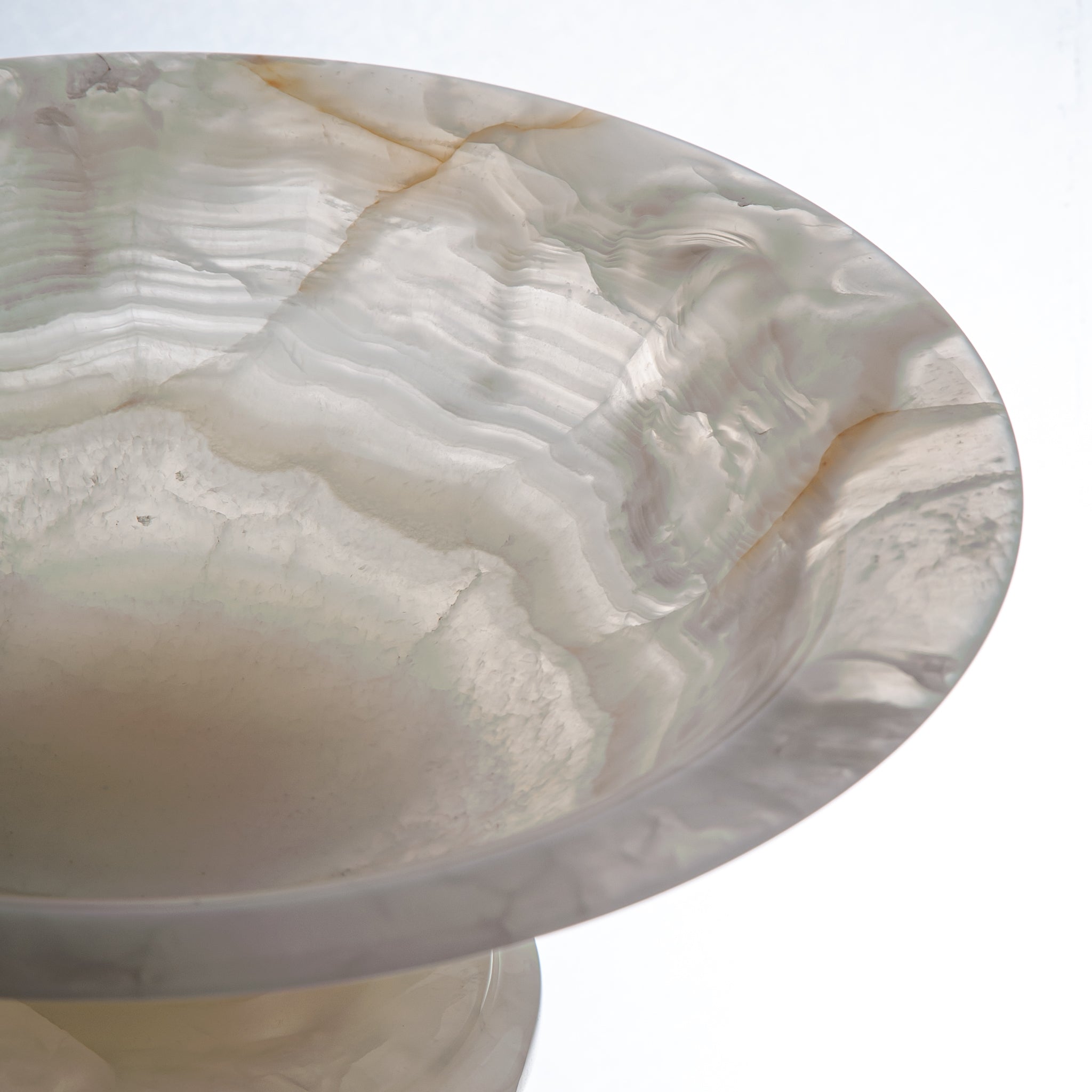 handcrafted onyx bowl with translucent ivory tones and natural veining for luxury table decor
