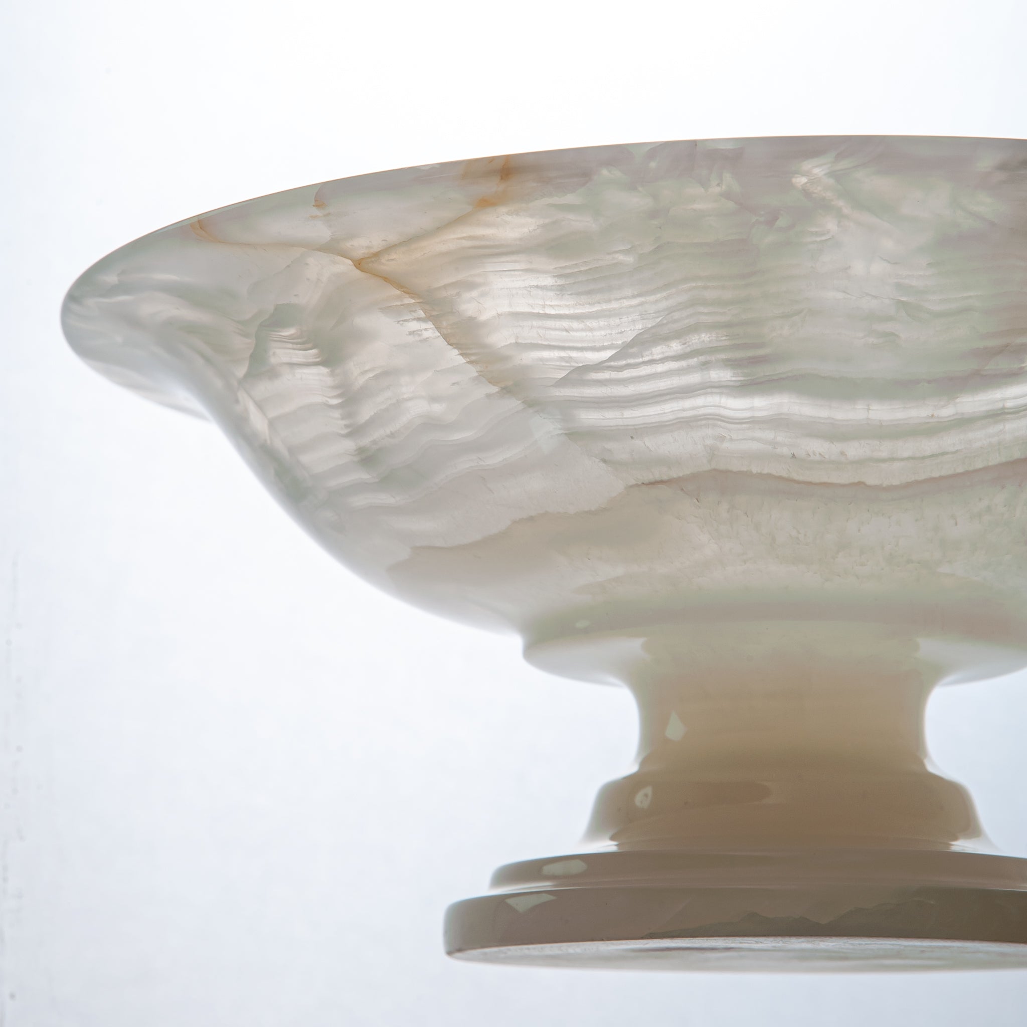 handcrafted onyx bowl with translucent ivory tones and natural veining for luxury table decor
