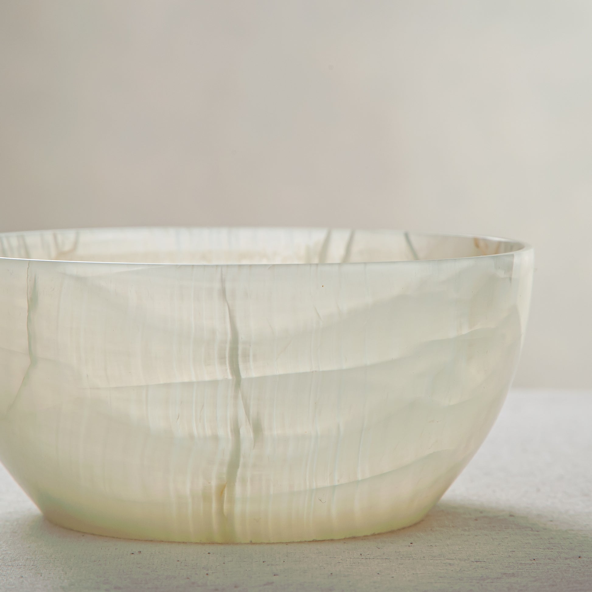 handcrafted onyx bowl with translucent milky texture and smooth rounded form for modern decor

