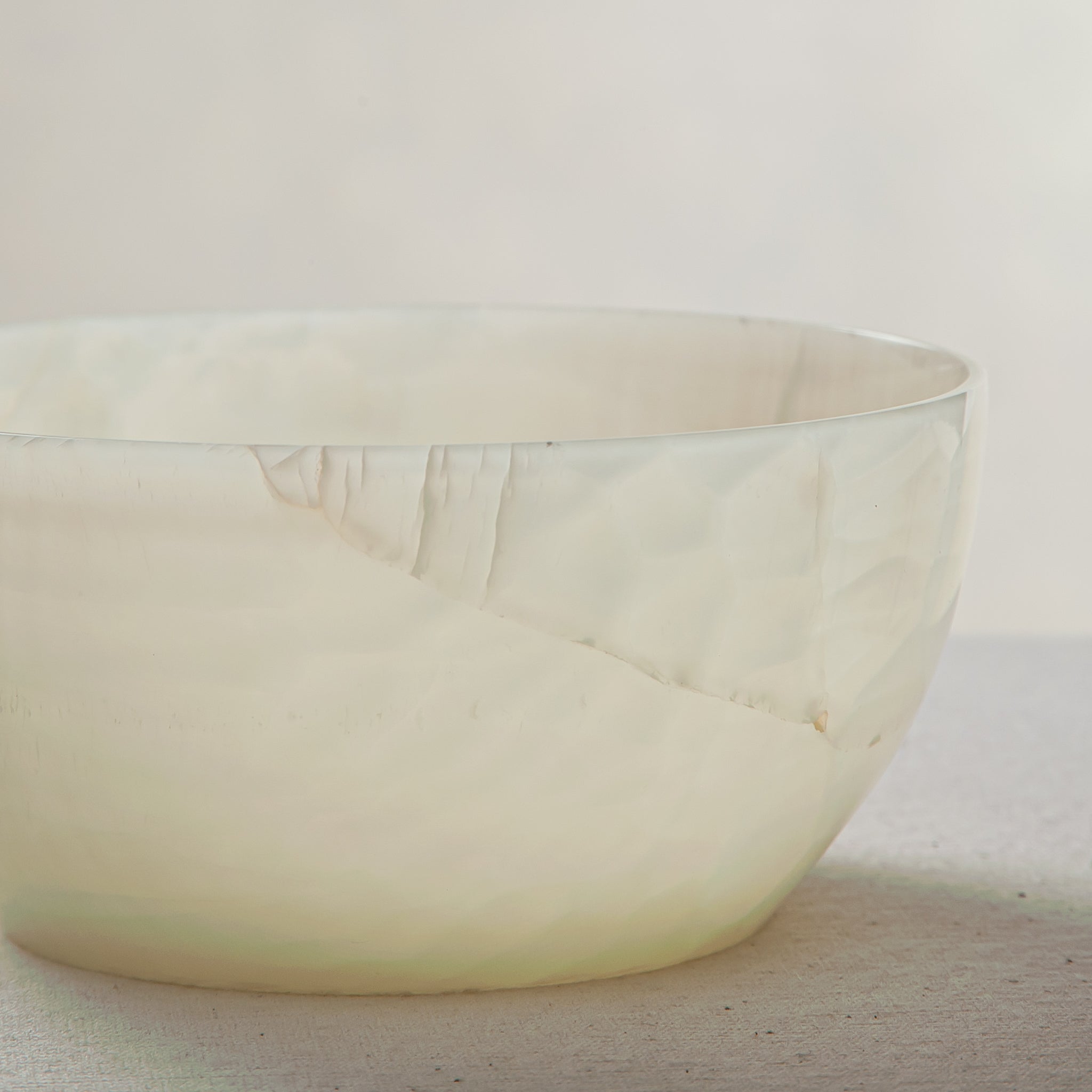 handcrafted onyx bowl with translucent milky texture and smooth rounded form for modern decor

