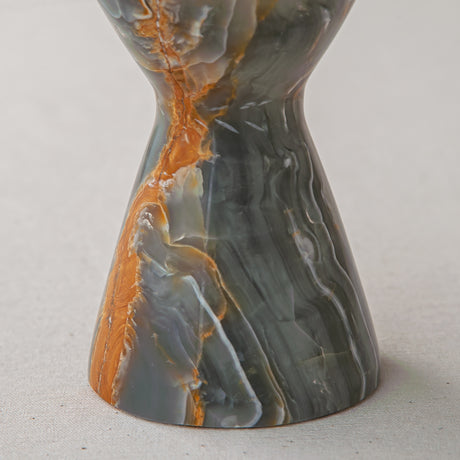 handcrafted onyx candle holder with green grey tones and amber veining for ambient decor
