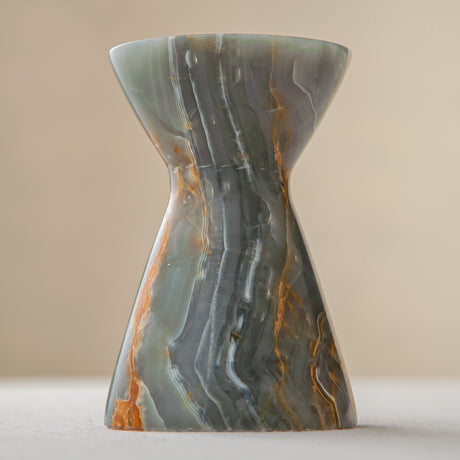 handcrafted onyx candle holder with green grey tones and amber veining for ambient decor