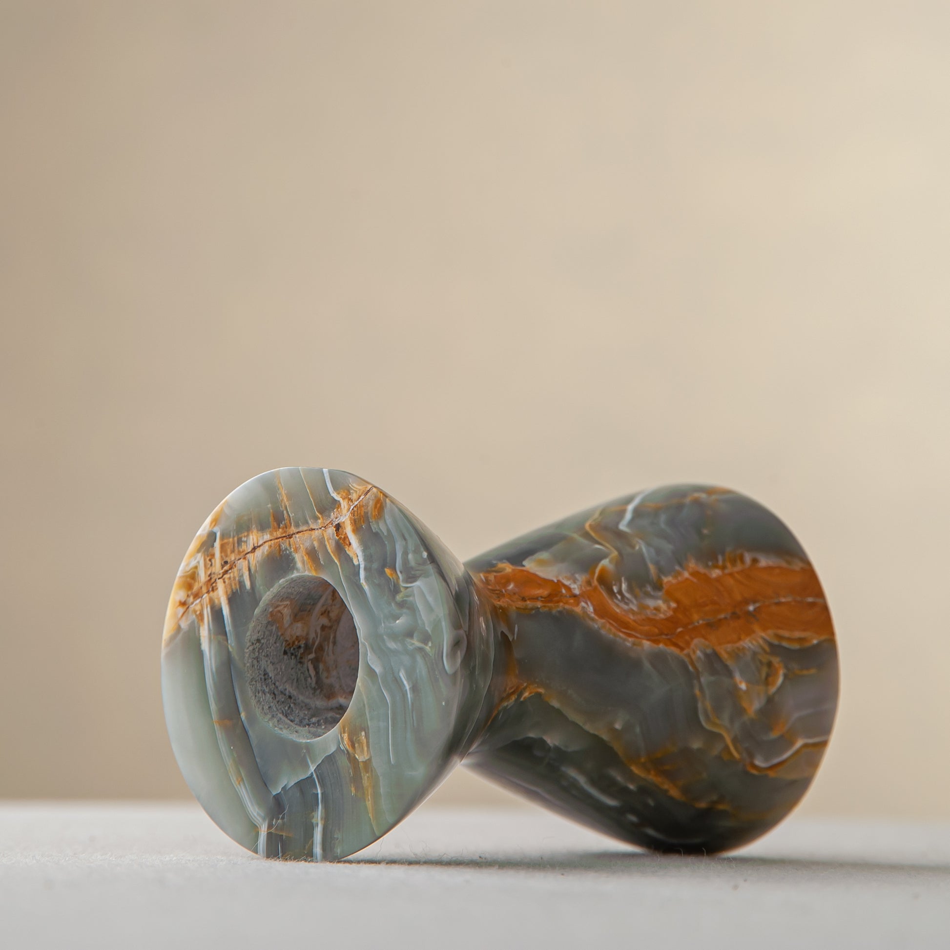 handcrafted onyx candle holder with green grey tones and amber veining for ambient decor