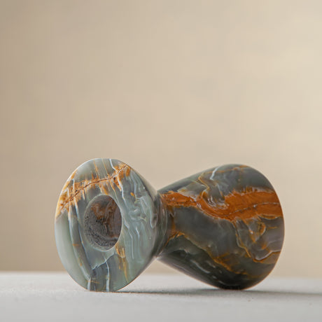 handcrafted onyx candle holder with green grey tones and amber veining for ambient decor