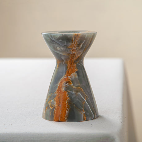 handcrafted onyx candle holder with green grey tones and amber veining for ambient decor