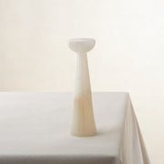 Unique onyx candle holder with ivory translucency and elongated sculptural form
