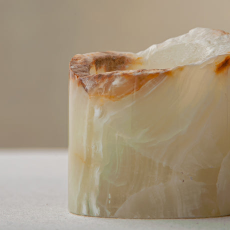 handcrafted onyx candle holder with raw edge ivory and amber veining for modern decor