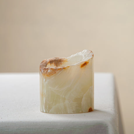 handcrafted onyx candle holder with raw edge ivory and amber veining for modern decor