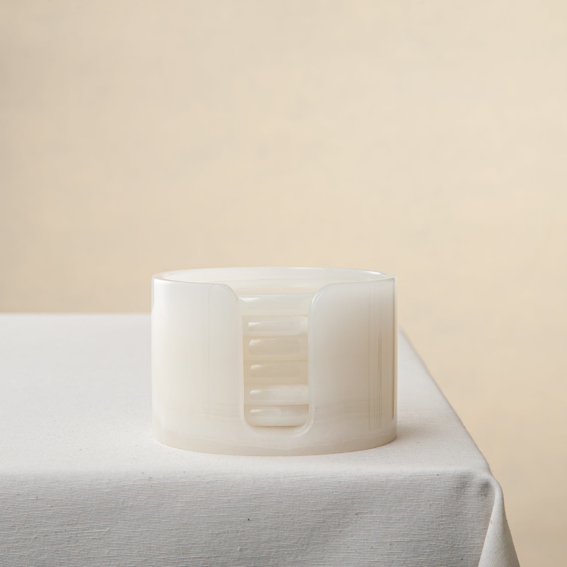 unique onyx coasters set translucent white stone handcrafted sculptural design table setting
