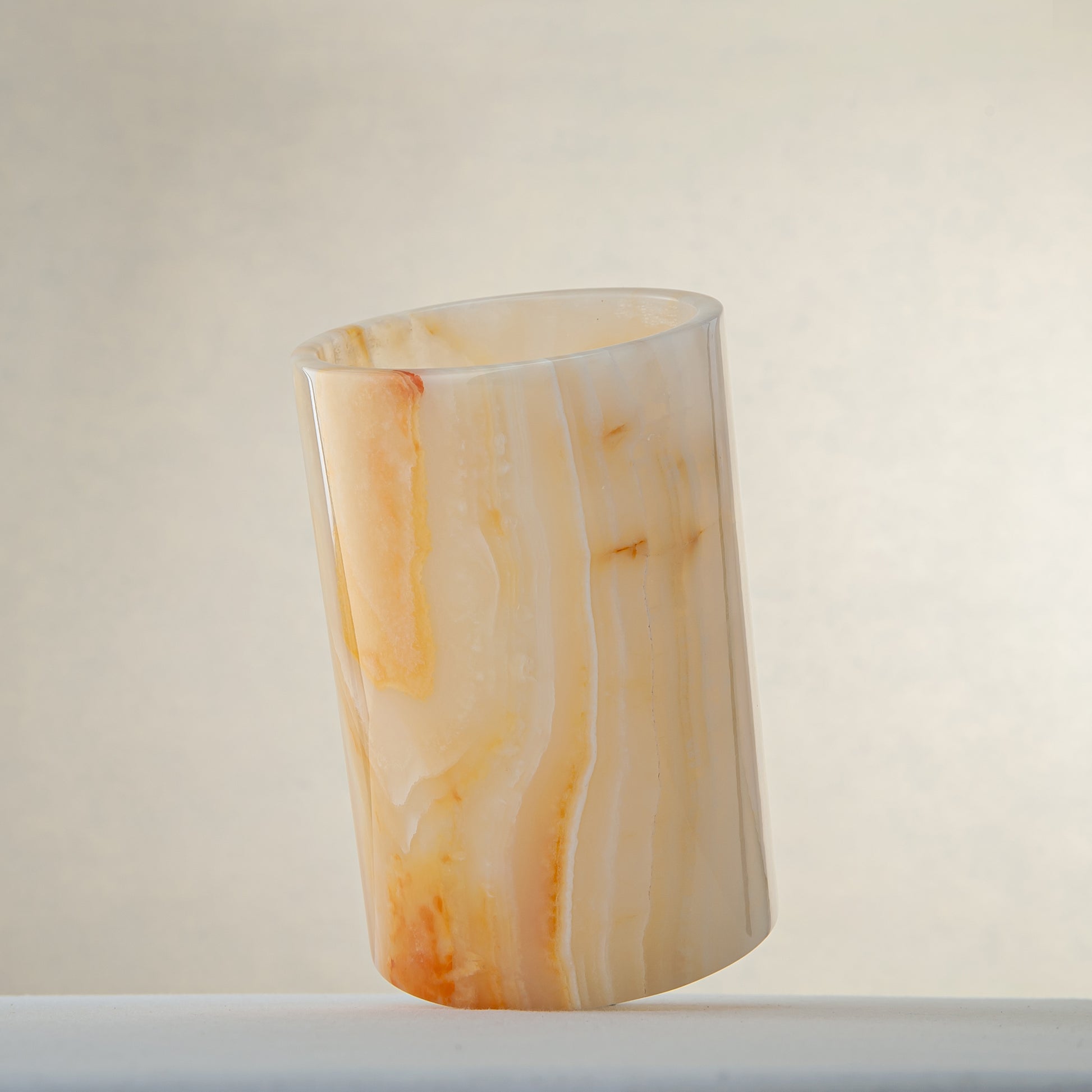 handcrafted onyx vase with honey and amber veining for elegant interior decor
