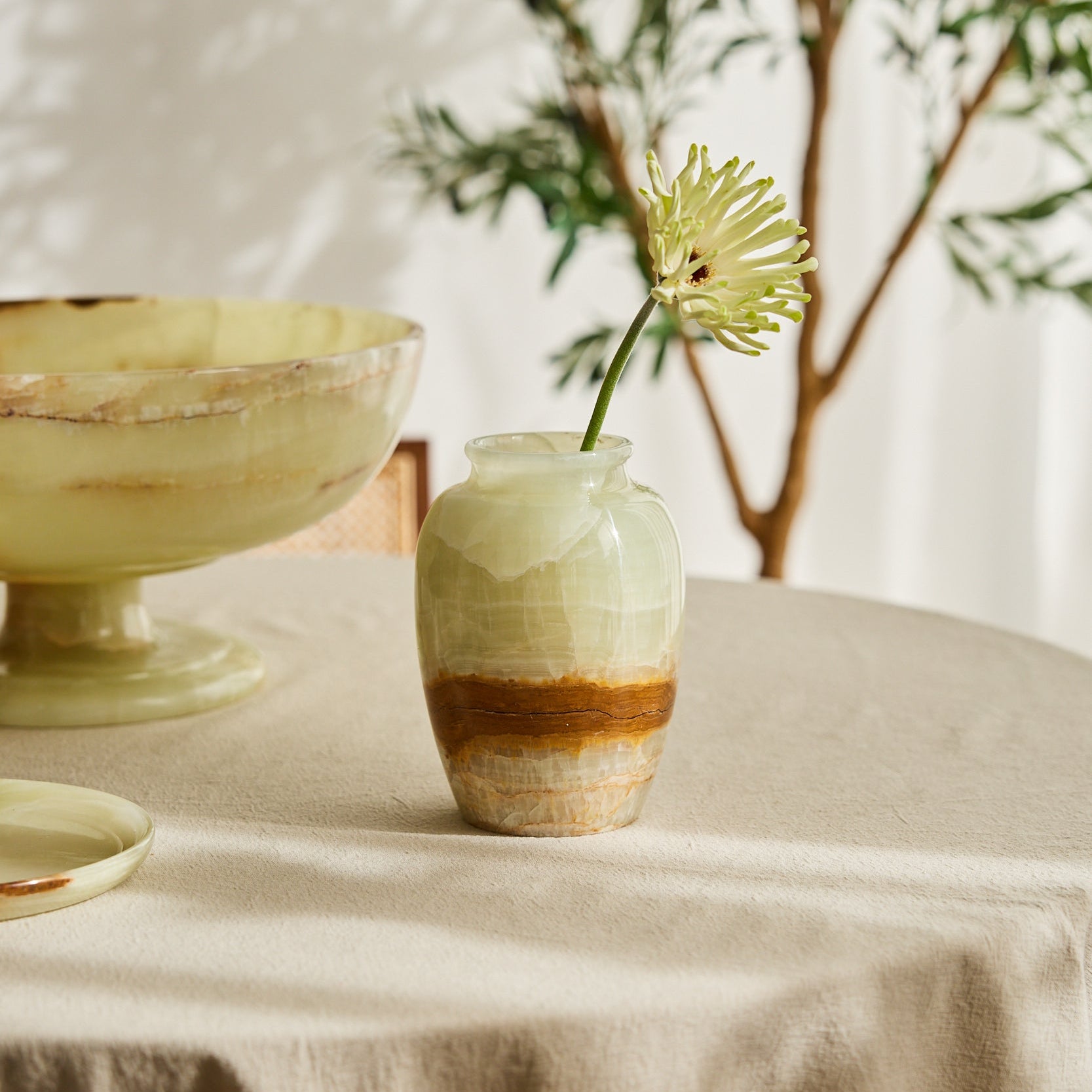 handcrafted onyx vase in ivory tones with warm amber veining for elegant decor
