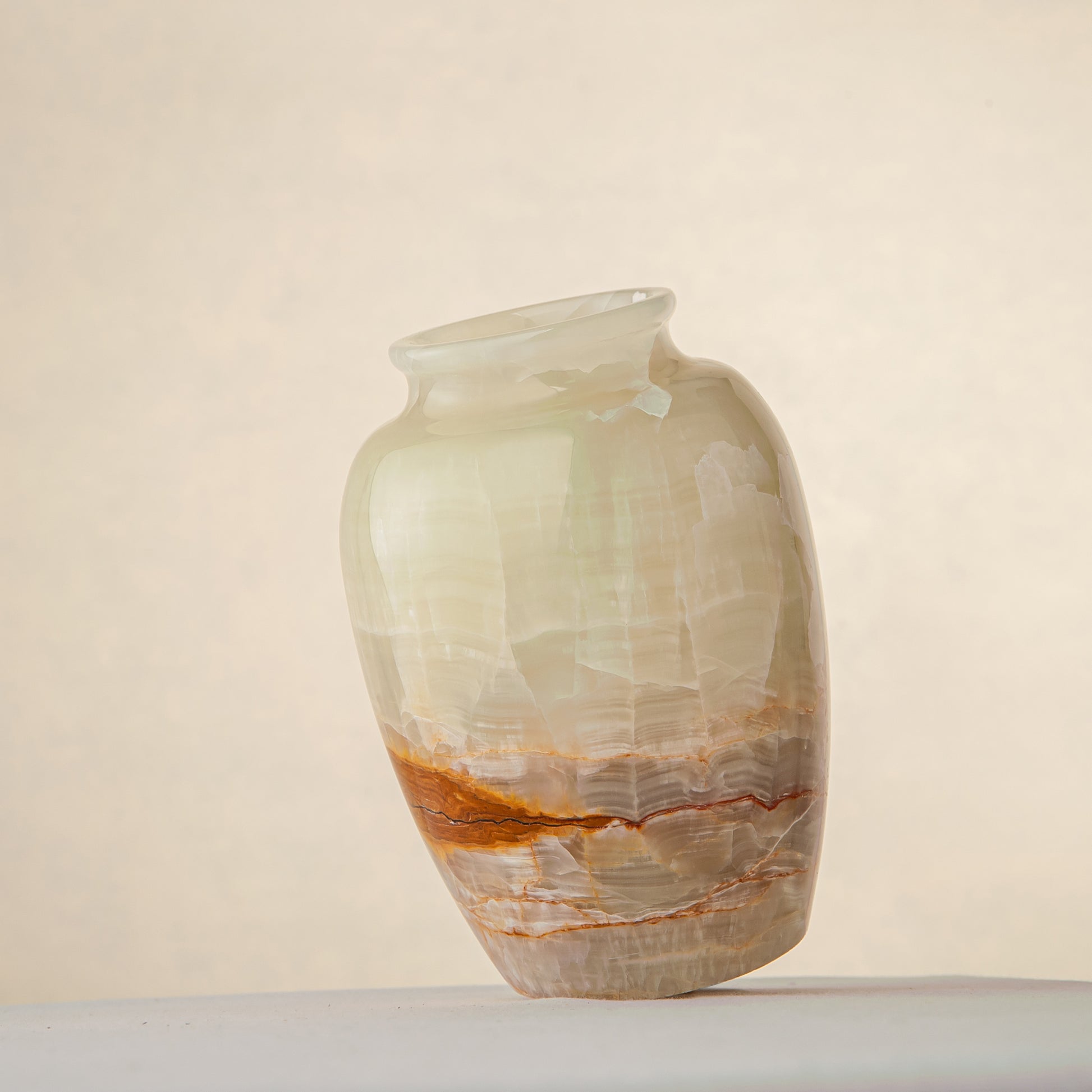 handcrafted onyx vase in ivory tones with warm amber veining for elegant decor
