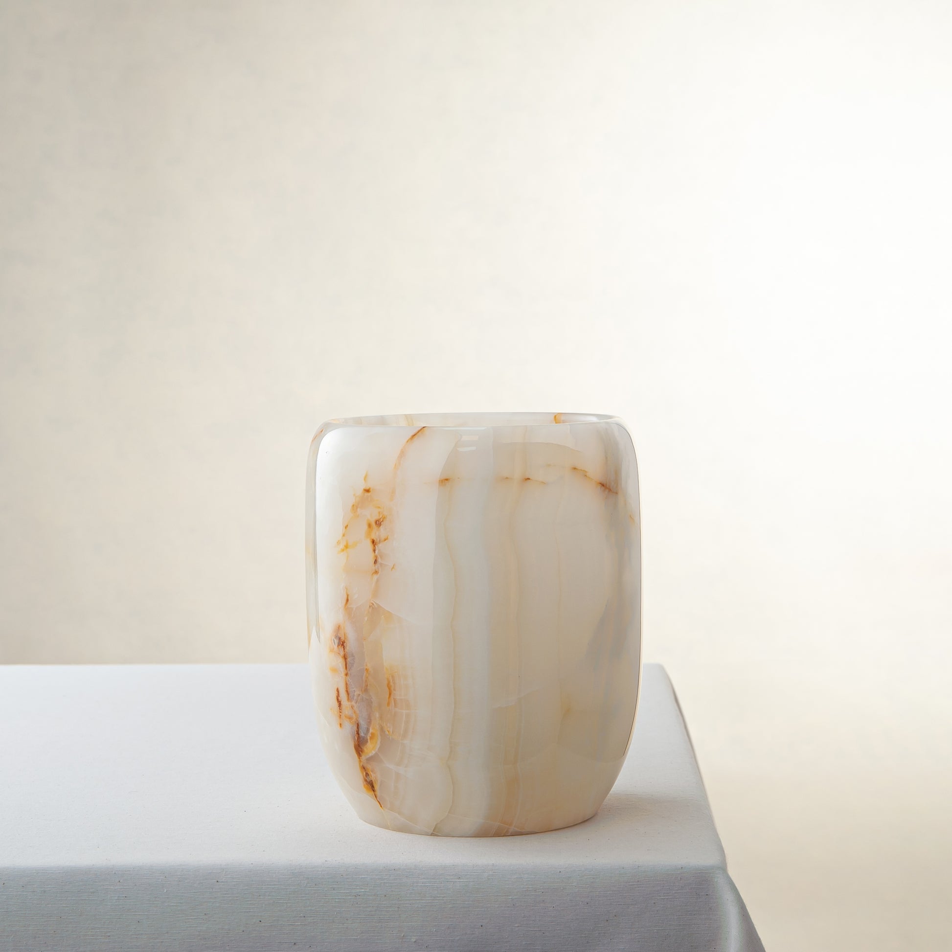 handcrafted onyx vase with ivory tones and soft honey veining for modern decor
