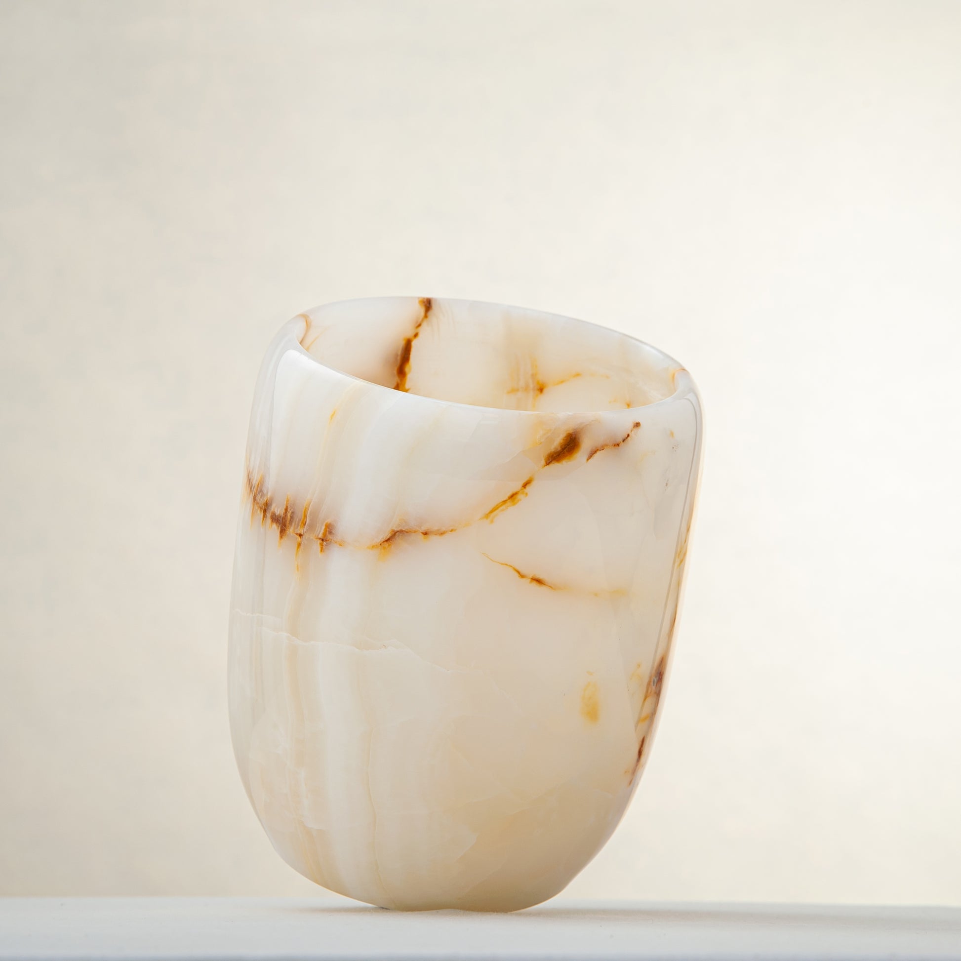 handcrafted onyx vase with ivory tones and soft honey veining for modern decor
