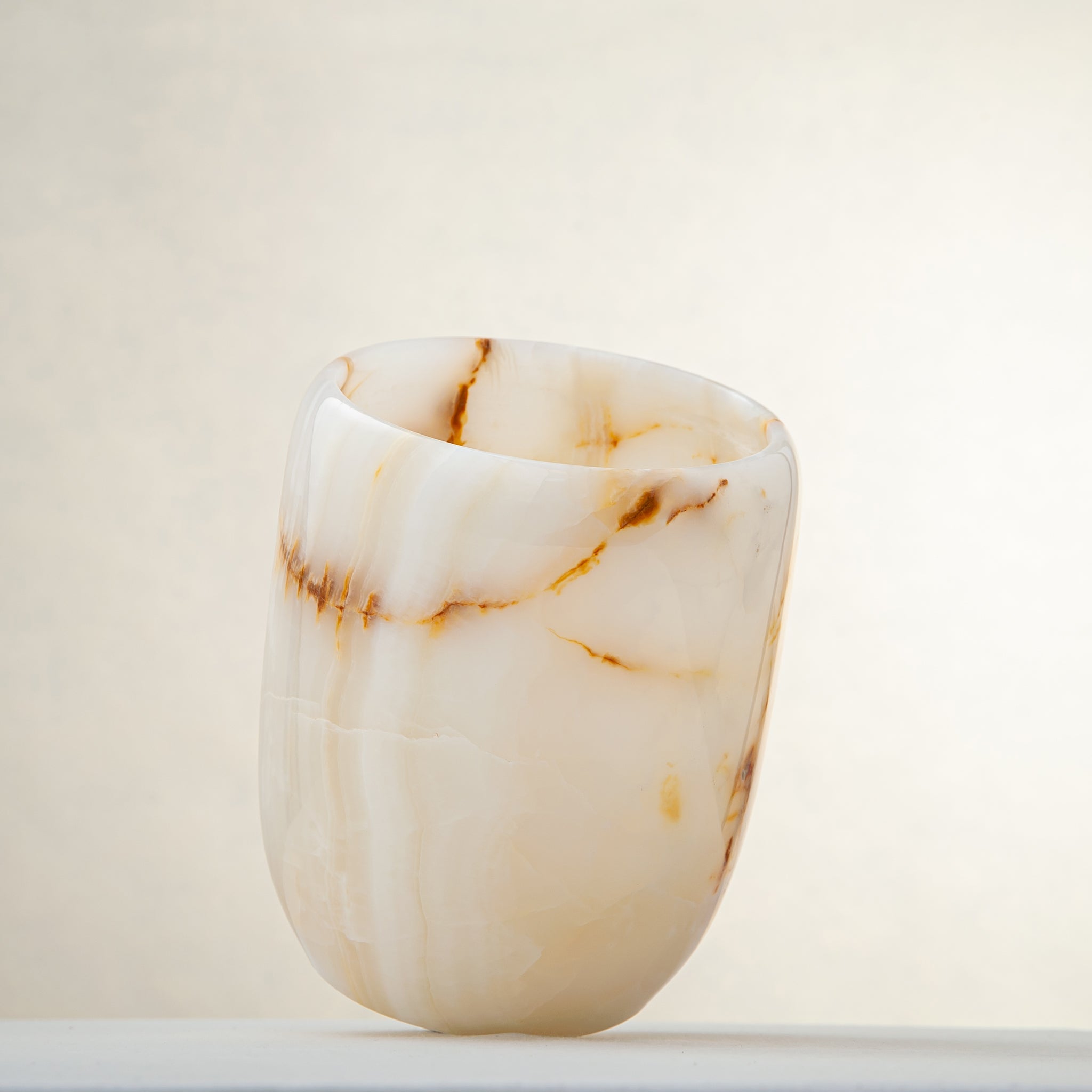 handcrafted onyx vase with ivory tones and soft honey veining for modern decor
