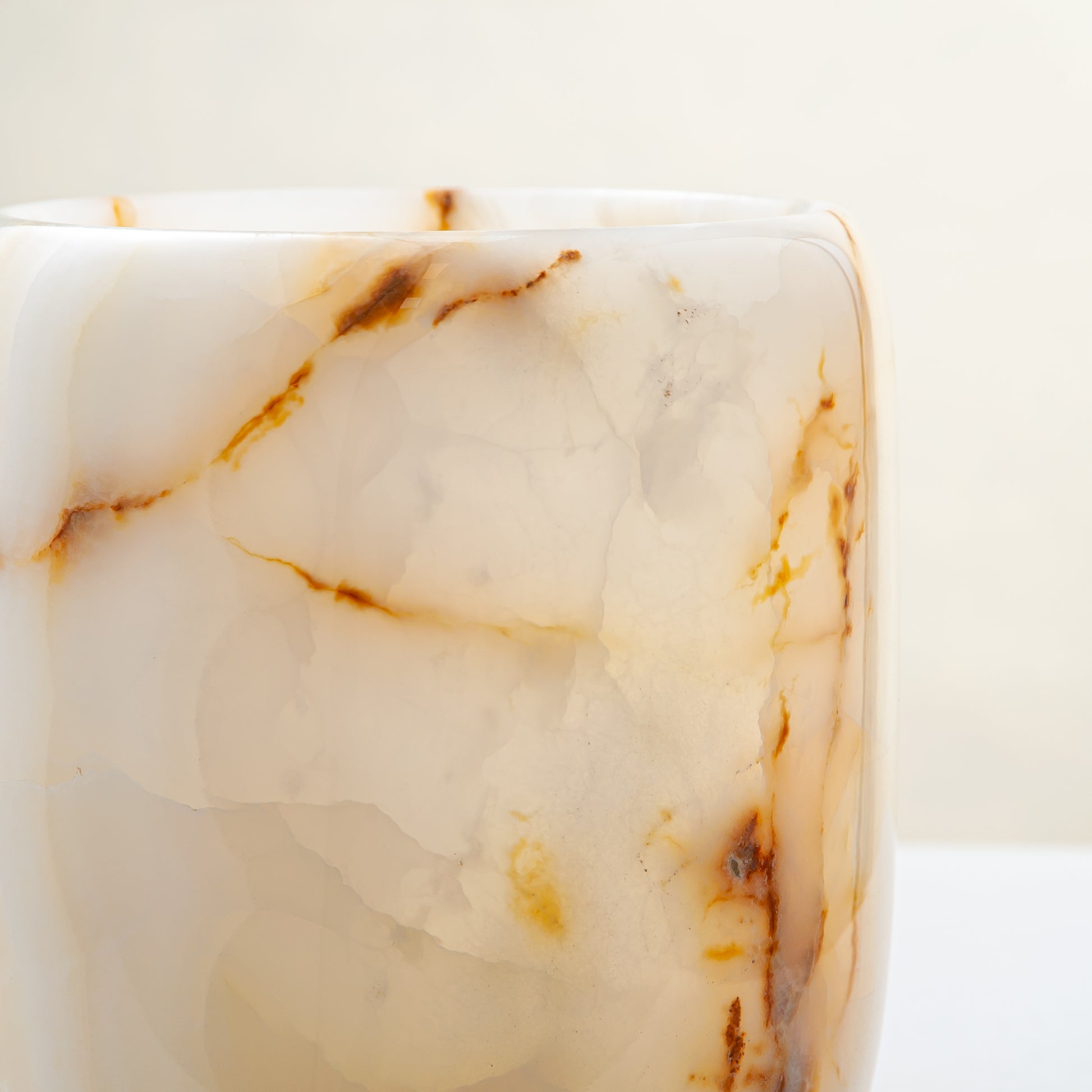 handcrafted onyx vase with ivory tones and soft honey veining for modern decor
