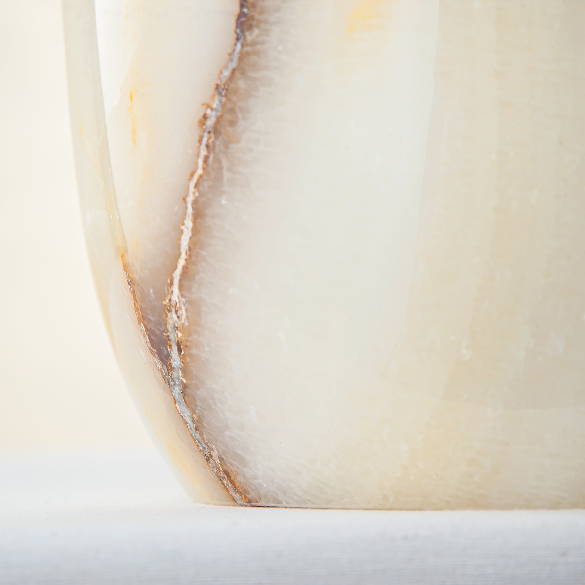 handcrafted onyx vase with ivory base and bold brown veining for modern decor
