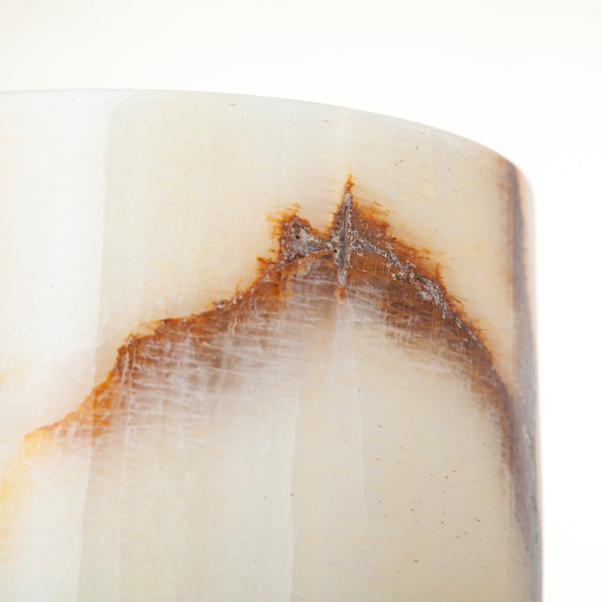 handcrafted onyx vase with ivory base and bold brown veining for modern decor
