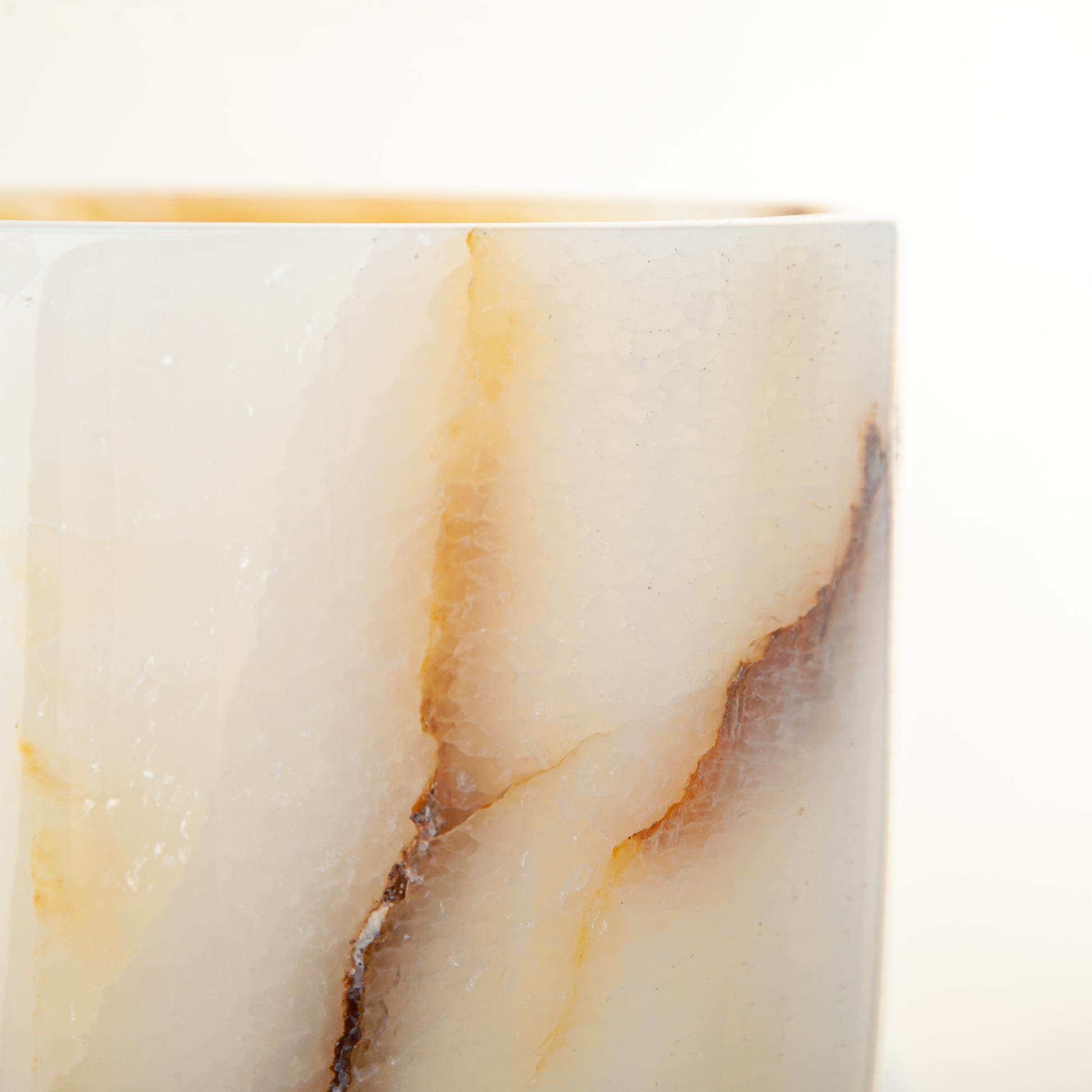 handcrafted onyx vase with ivory base and bold brown veining for modern decor
