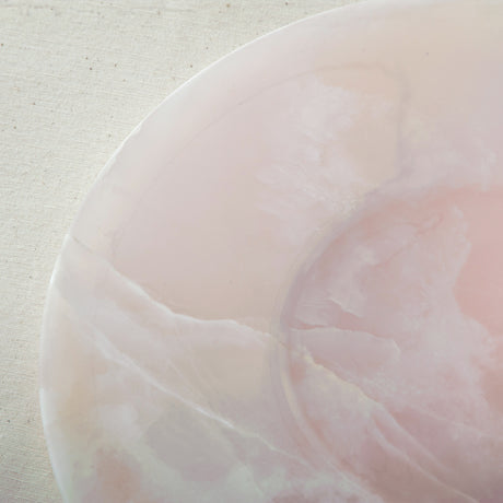 handcrafted pink onyx plate with smooth round shape and soft blush tones for modern table decor
