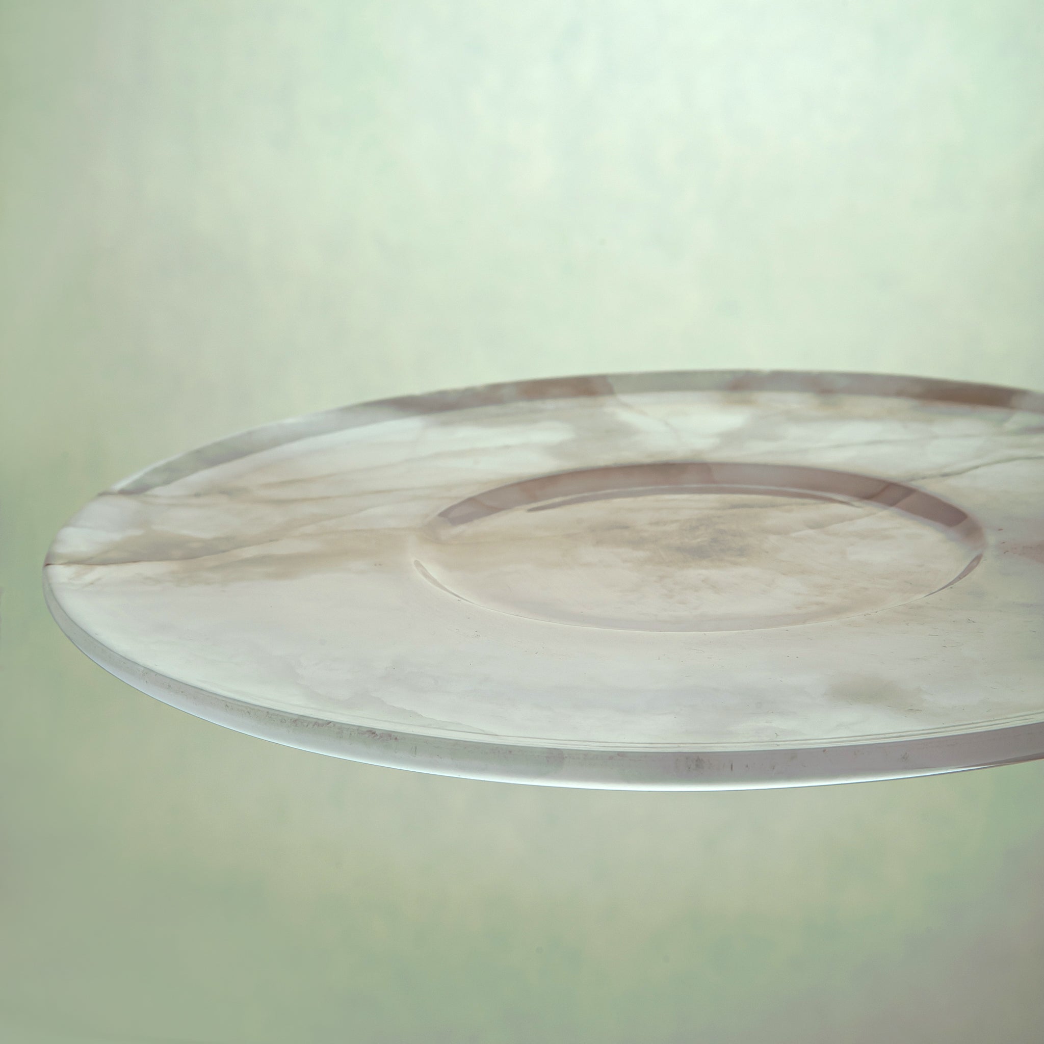 handcrafted pink onyx plate with smooth round shape and soft blush tones for modern table decor
