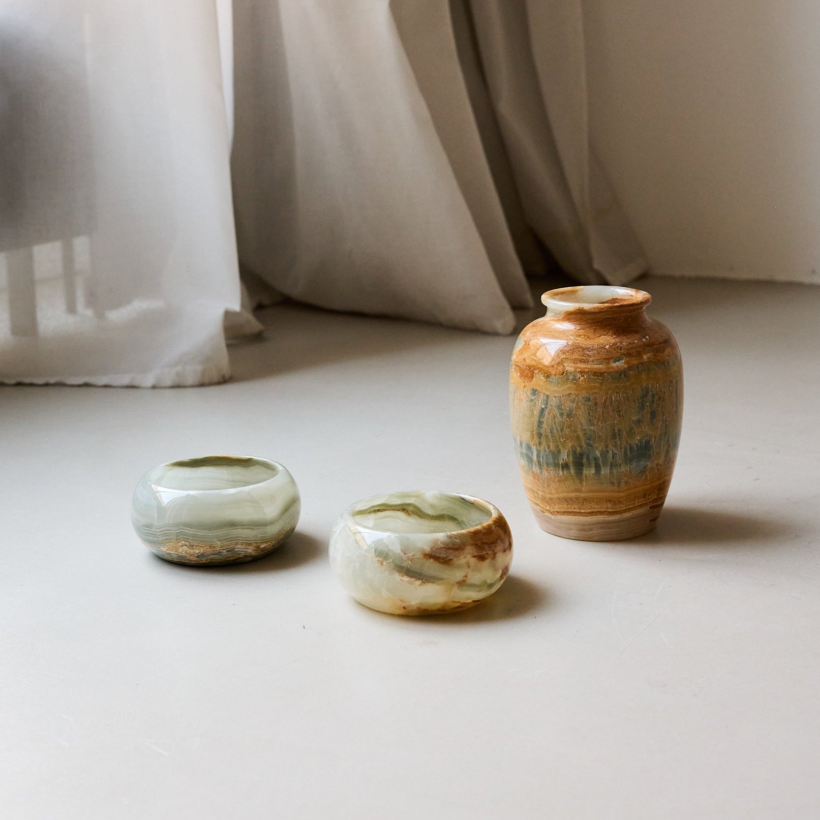 Small green with brown onyx bowl with matching onyx vase